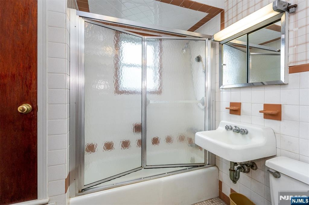 66 Coeyman Avenue Bloomfield, NJ 07003 - Photo 20 of 29 a bathroom with a sink toilet and shower
