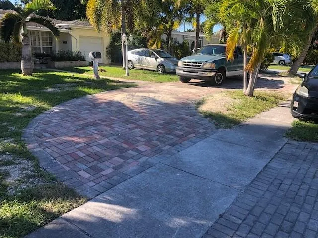a view of a street with cars parked