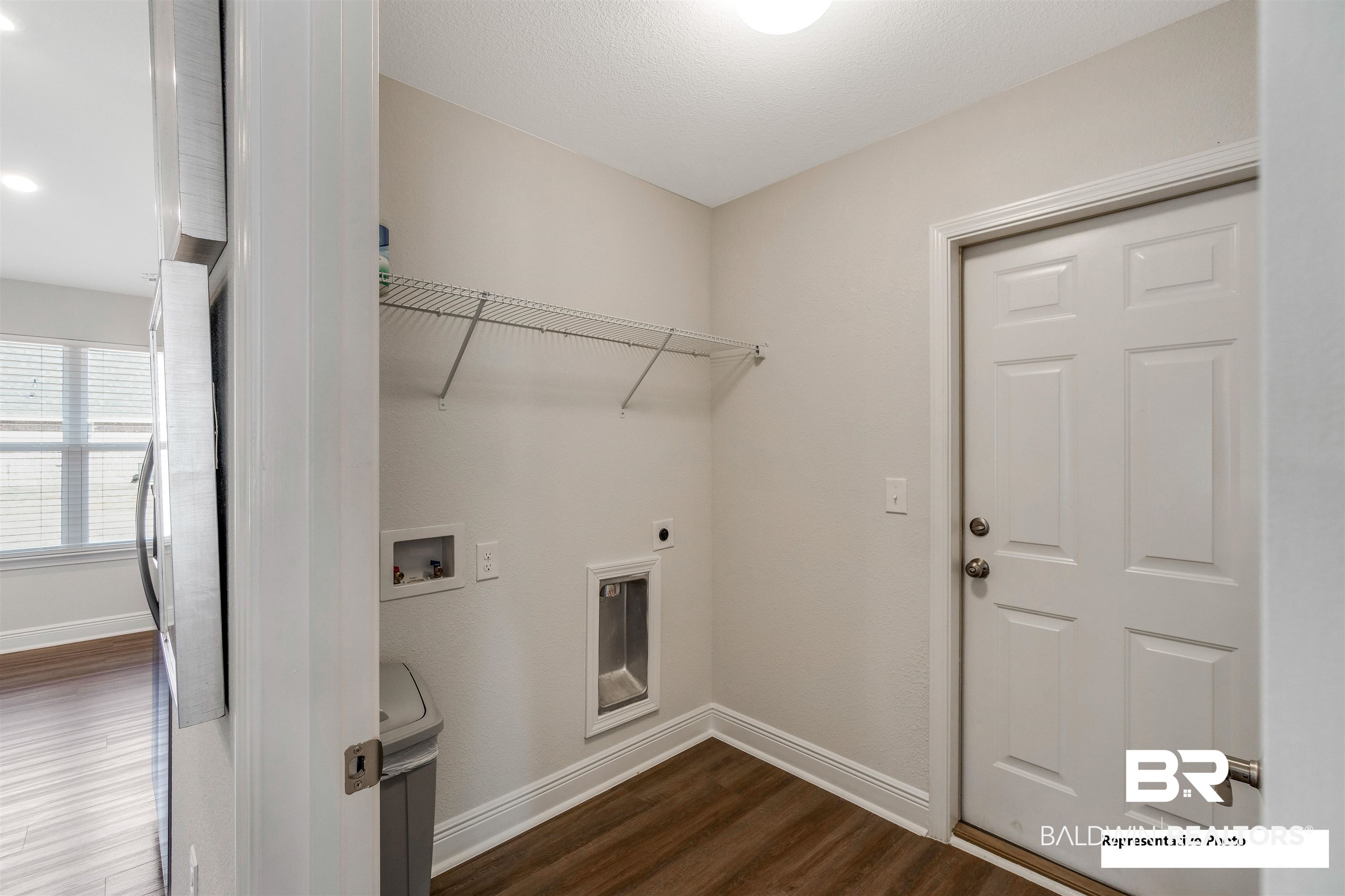 643 Mayflower Drive Foley, AL 36535 - Photo 18 of 34 Clothes washing area with dark wood-style floors, washer hookup, hookup for an electric dryer, laundry area, and baseboards