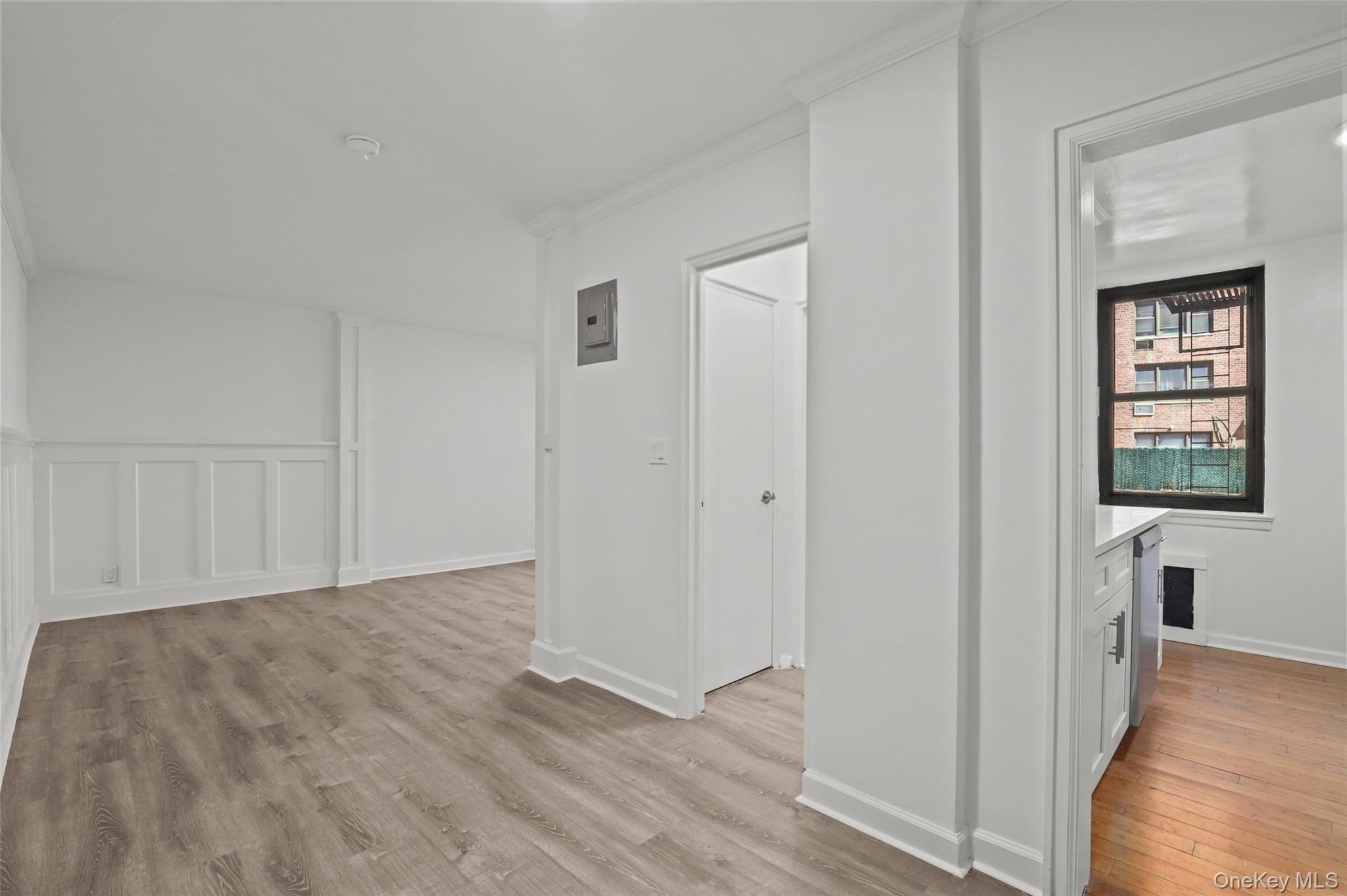 555 Bronx River Road, Unit 1J Yonkers, NY 10704 - Photo 3 of 11 a view of hallway with window and wooden floor