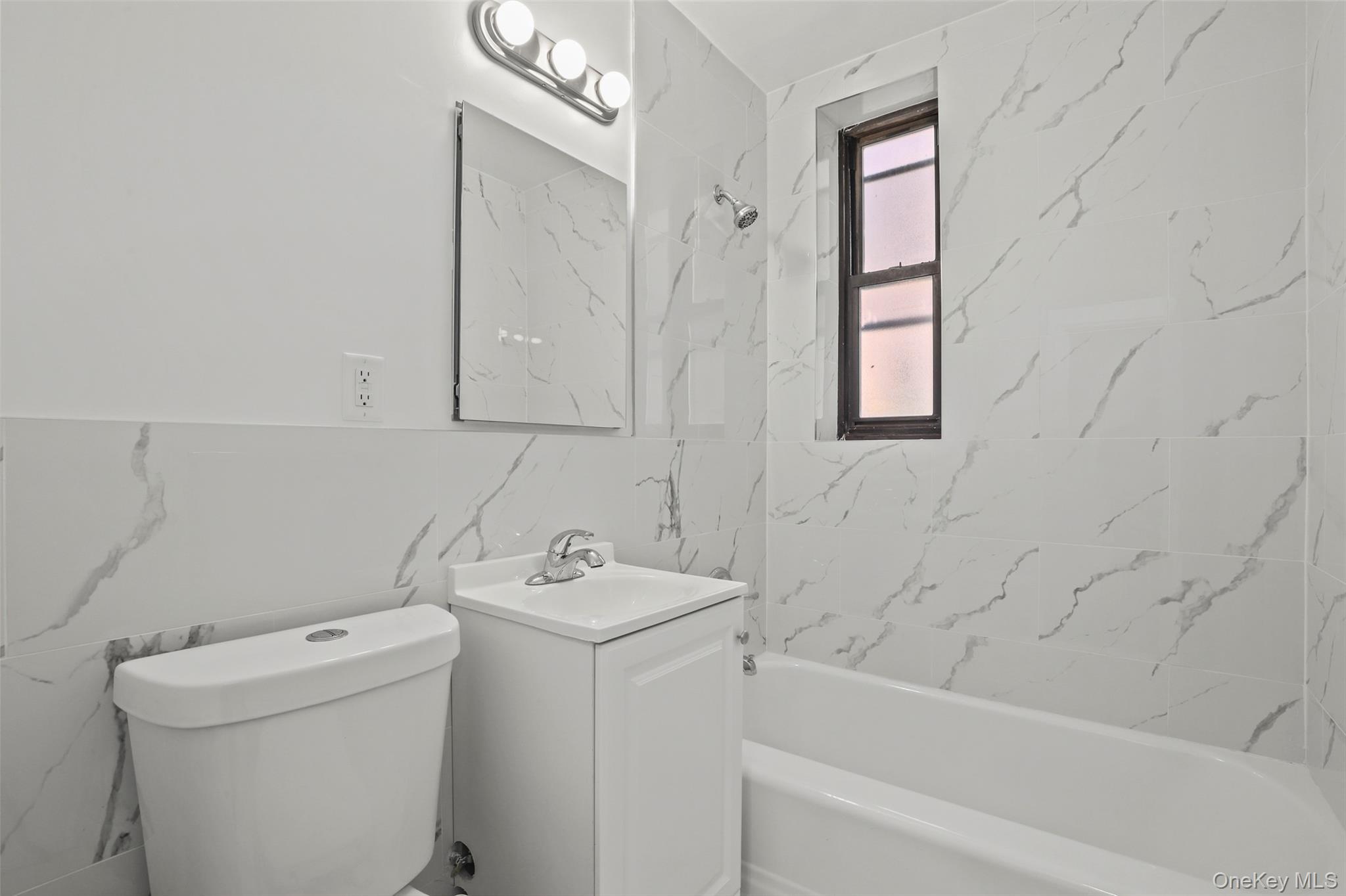 555 Bronx River Road, Unit 1J Yonkers, NY 10704 - Photo 5 of 11 Full bath with washtub / shower combination and vanity