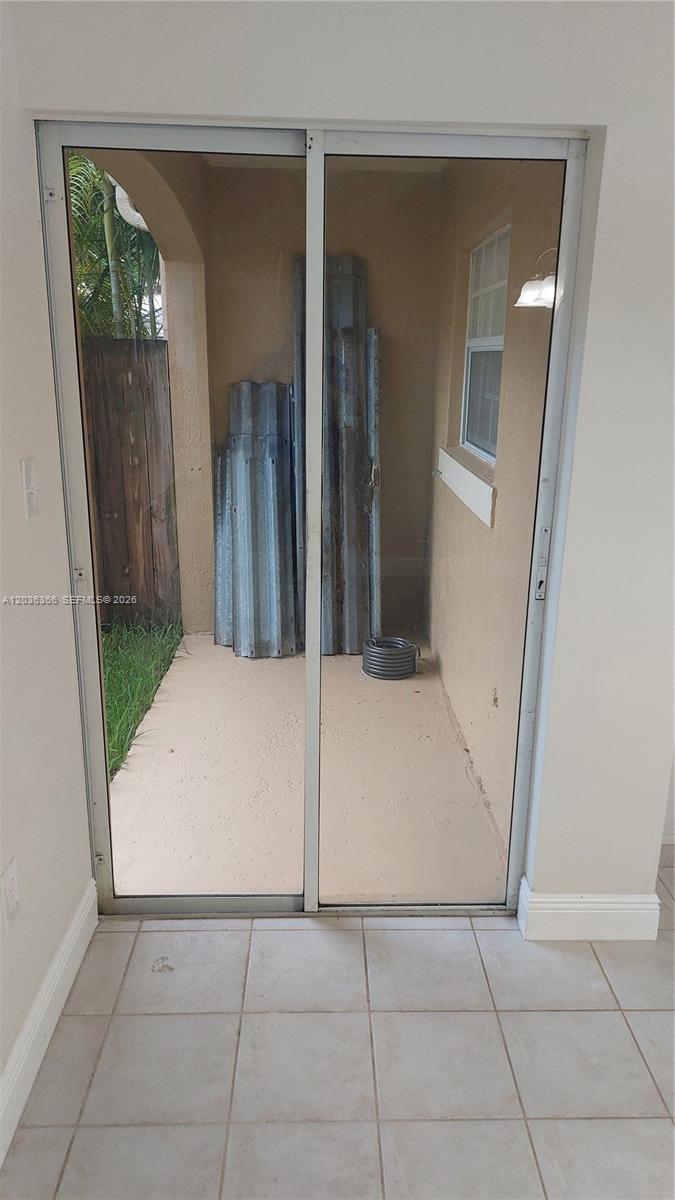 7083 Southwest 158th Court Miami, FL 33193 - Photo 11 of 22 wooden floor in a hallway with a window
