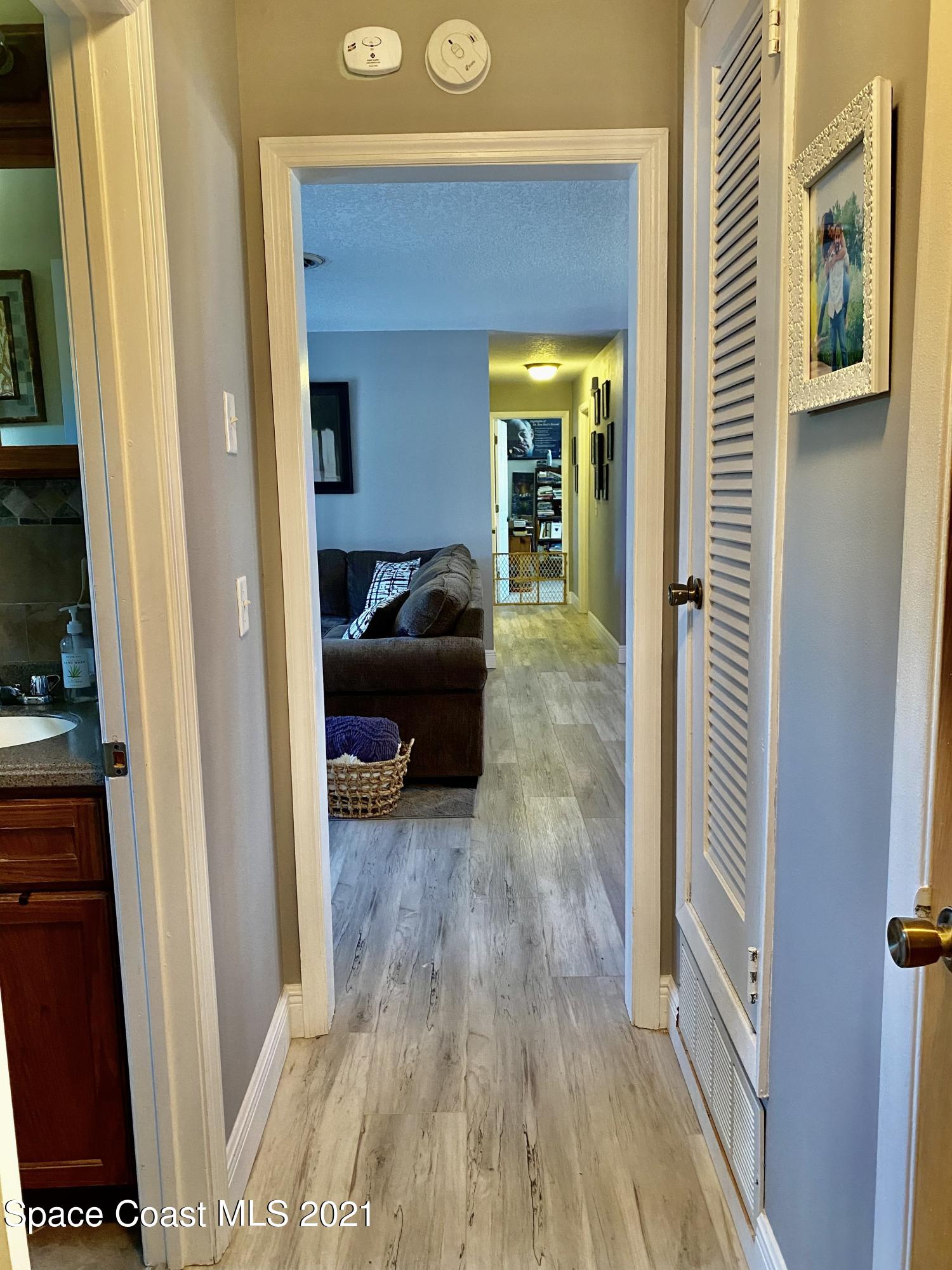 993 Cardon Drive Rockledge, FL 32955 - Photo 16 of 22 a living room with furniture and a gate