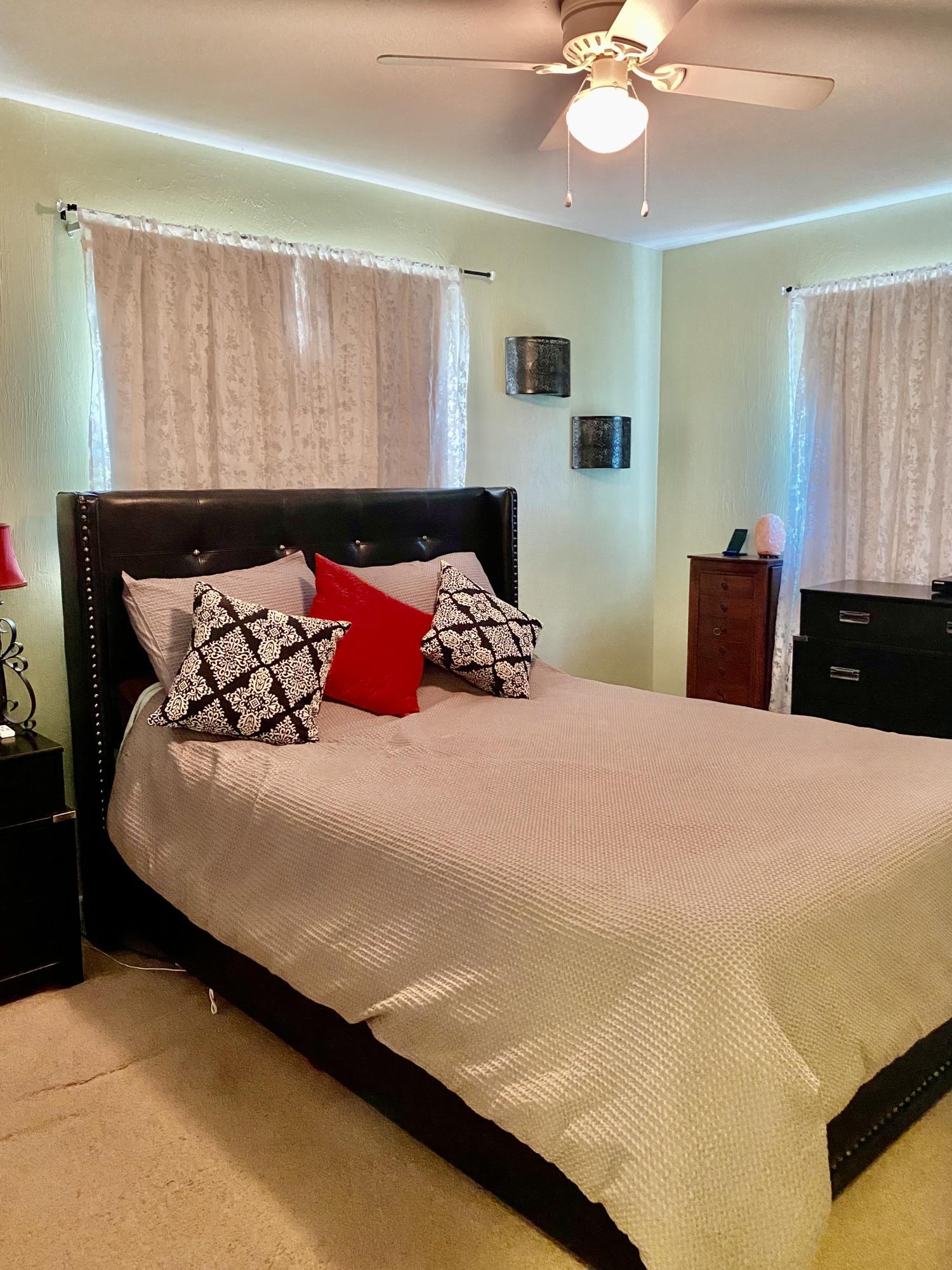 993 Cardon Drive Rockledge, FL 32955 - Photo 17 of 22 a bedroom with a bed and window