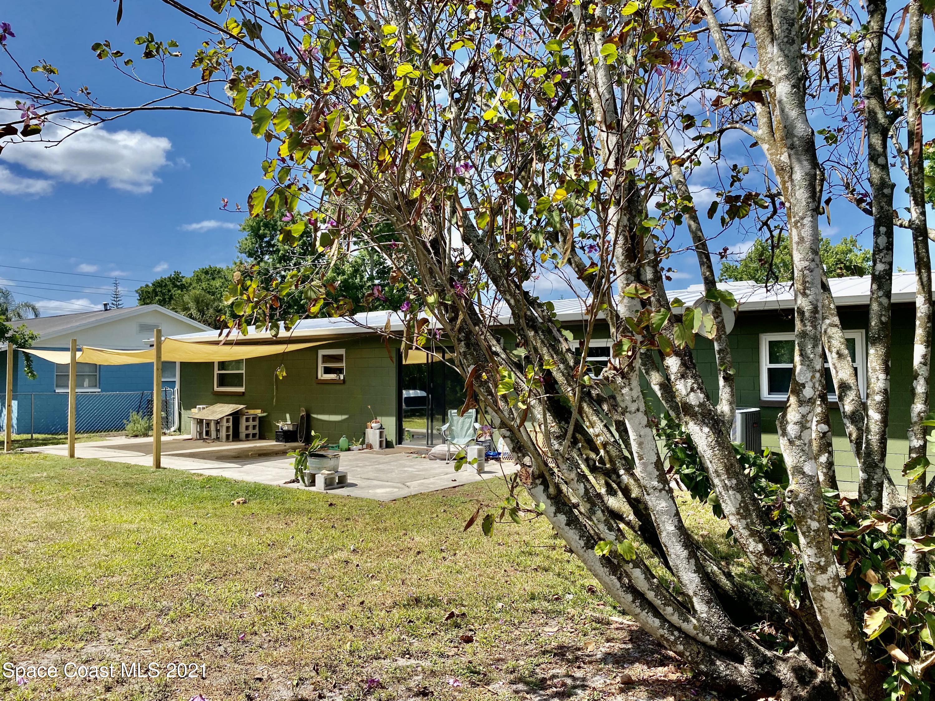 993 Cardon Drive Rockledge, FL 32955 - Photo 21 of 22 a view of a swimming pool with a patio