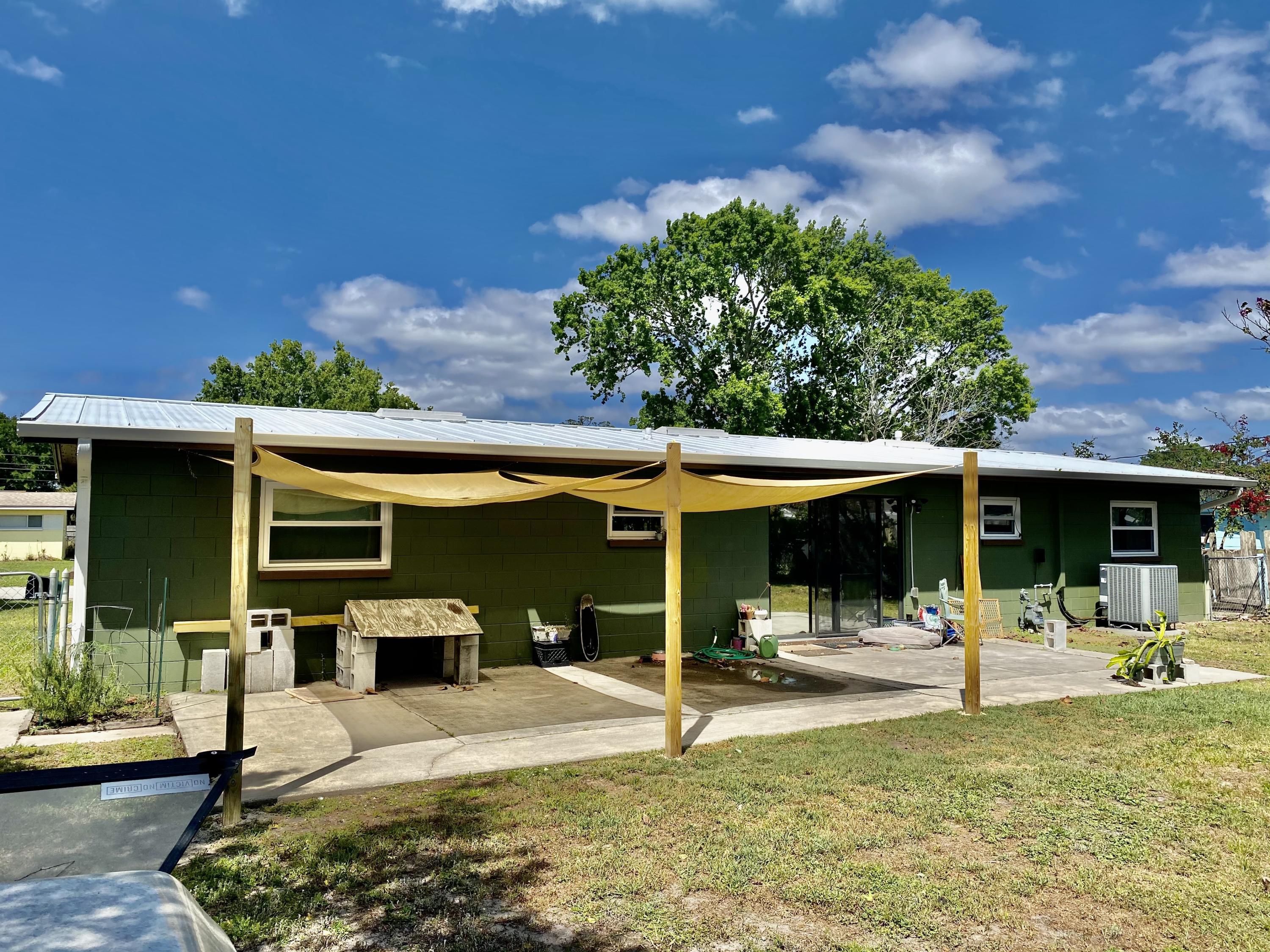 993 Cardon Drive Rockledge, FL 32955 - Photo 22 of 22 a view of a swimming pool with a patio