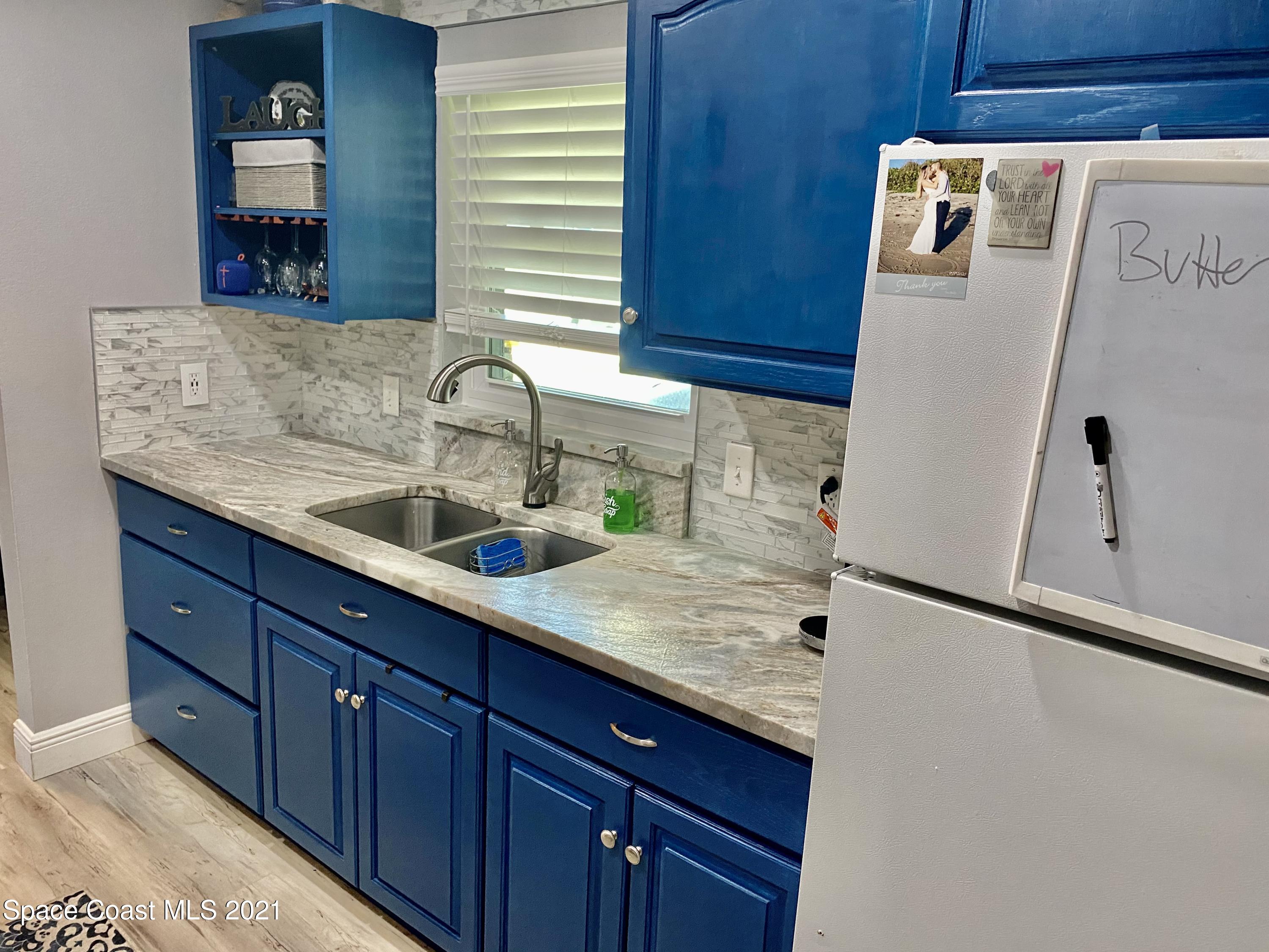993 Cardon Drive Rockledge, FL 32955 - Photo 4 of 22 a bathroom with a sink and a mirror