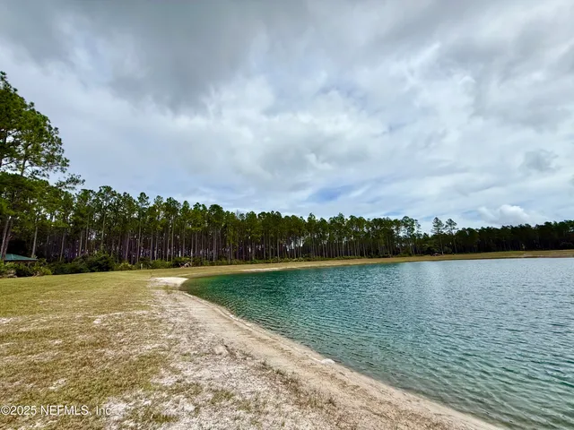 a view of a lake with a big yard