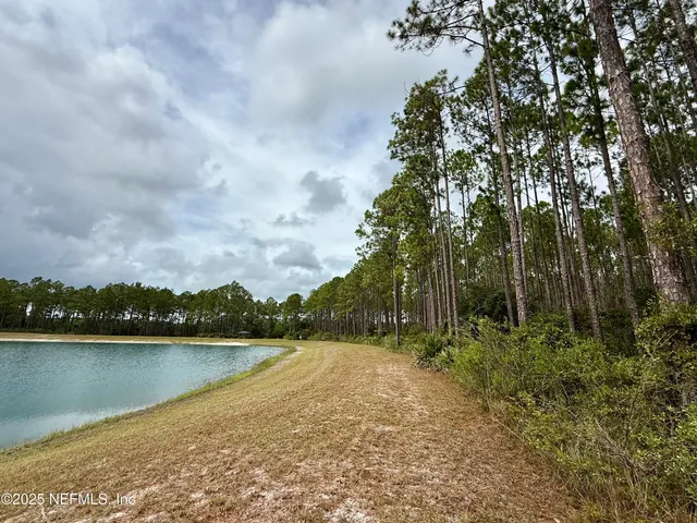 a view of lake with green space