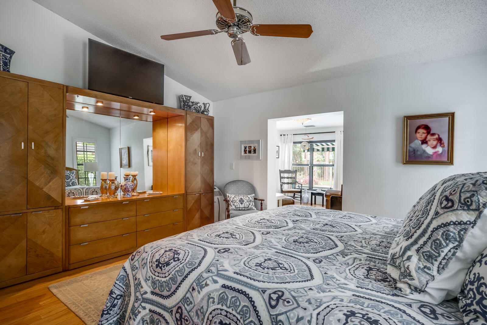 172 Wild Pine Road Wellington, FL 33414 - Photo 17 of 38 a bedroom with a large bed and a large window