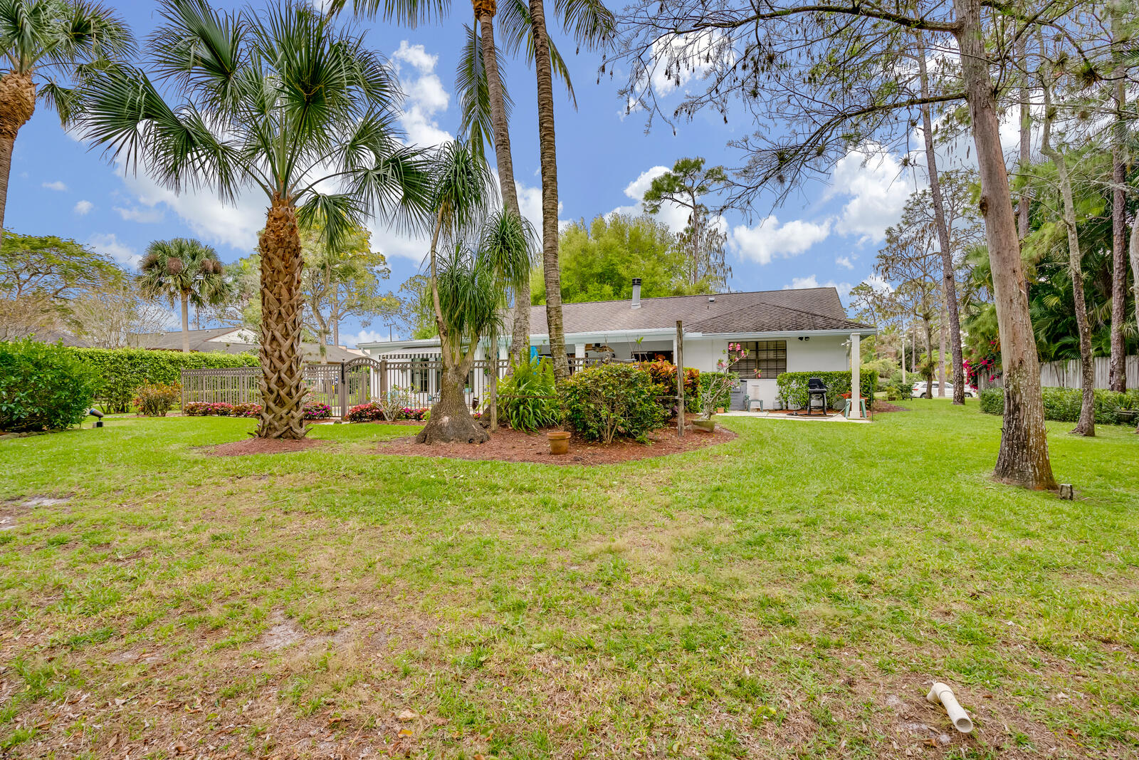 172 Wild Pine Road Wellington, FL 33414 - Photo 30 of 38 a house with garden view