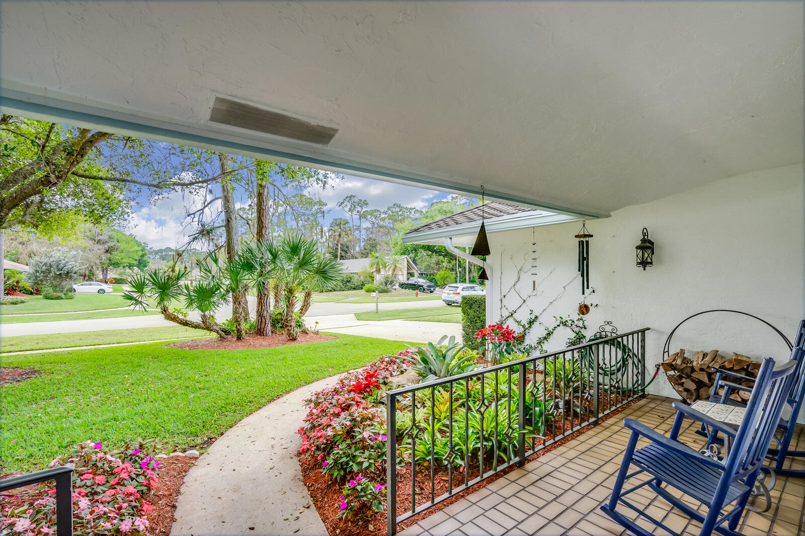 172 Wild Pine Road Wellington, FL 33414 - Photo 4 of 38 a front view of a house with garden
