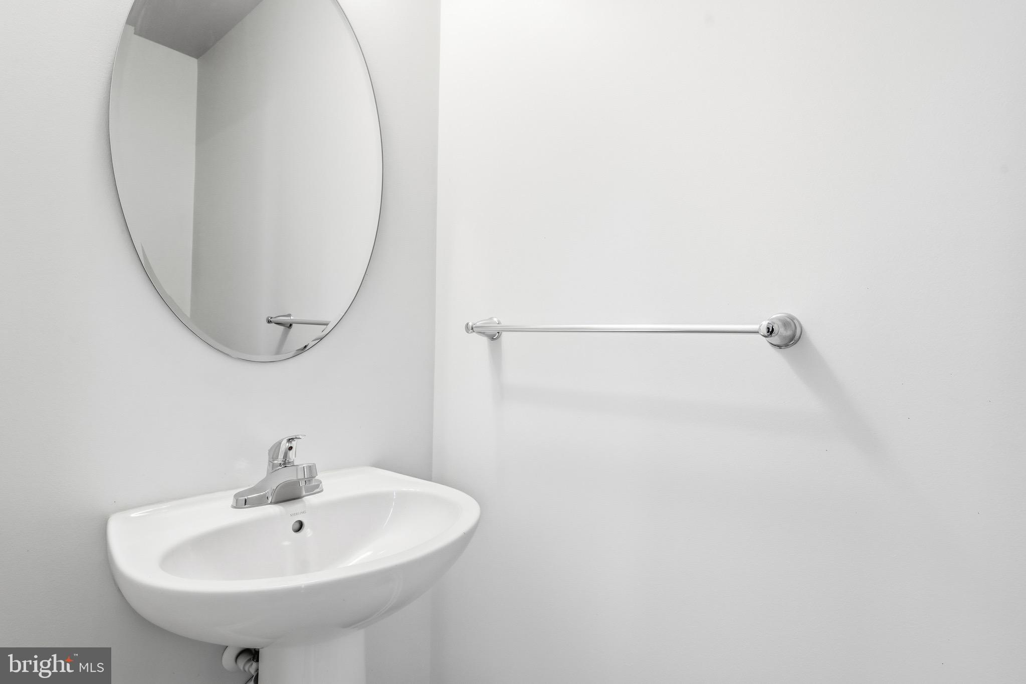 35209 Sara Court Locust Grove, VA 22508 - Photo 13 of 37 a bathroom with a sink a shower and a mirror