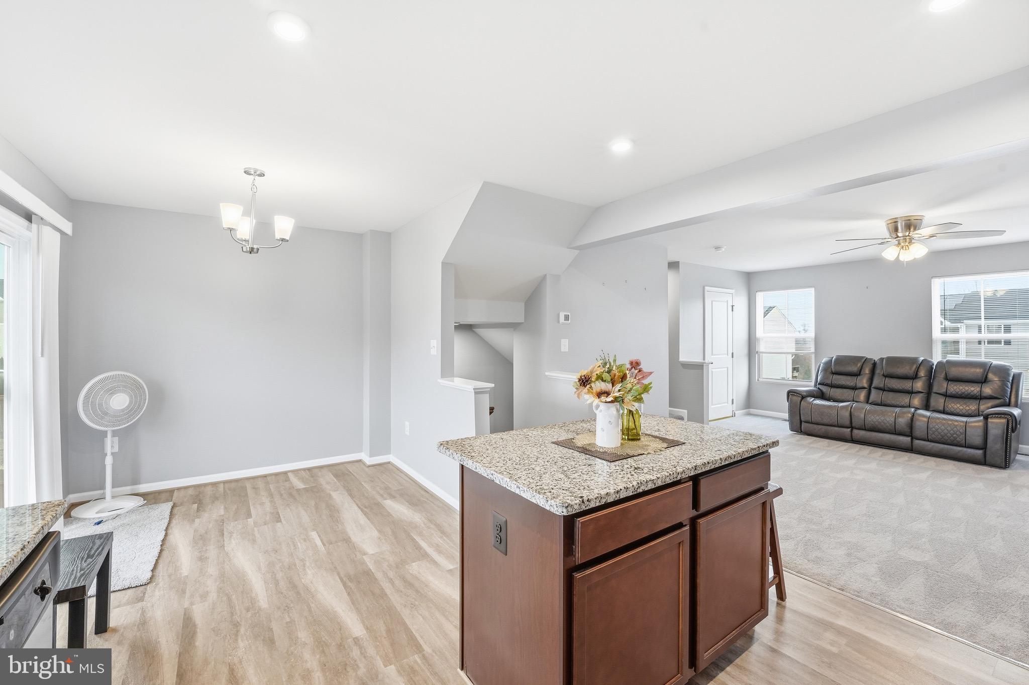 35209 Sara Court Locust Grove, VA 22508 - Photo 18 of 37 a living room with granite countertop furniture and fireplace