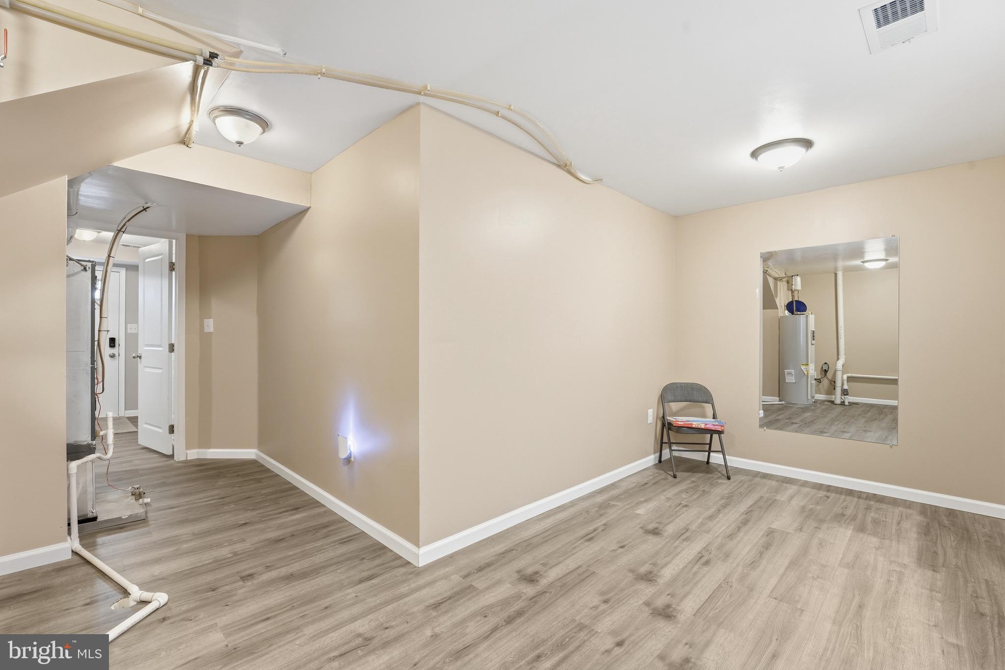 35209 Sara Court Locust Grove, VA 22508 - Photo 24 of 37 a view of empty room with wooden floor