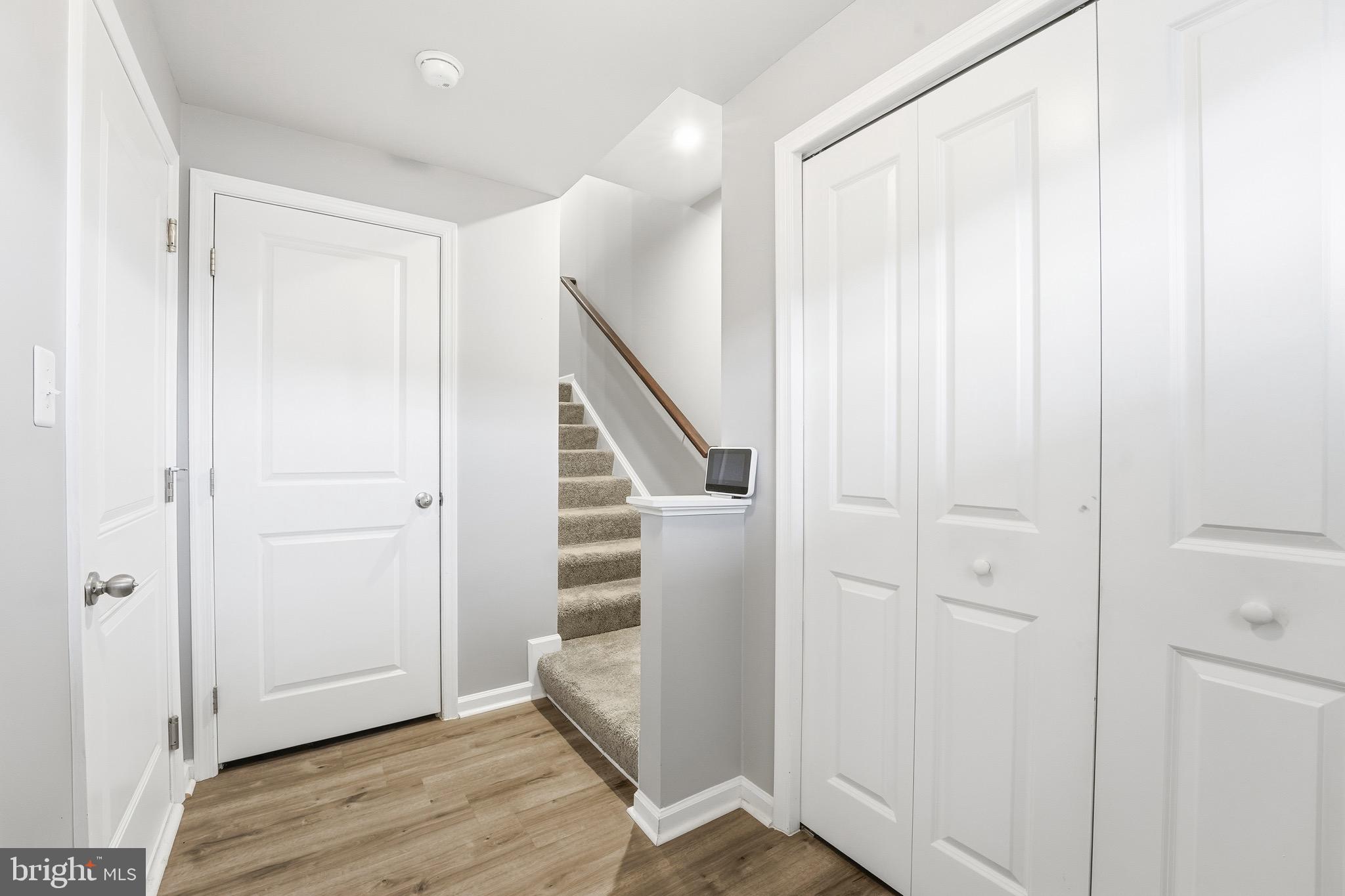 35209 Sara Court Locust Grove, VA 22508 - Photo 25 of 37 a view of entryway with stairs and wooden floor