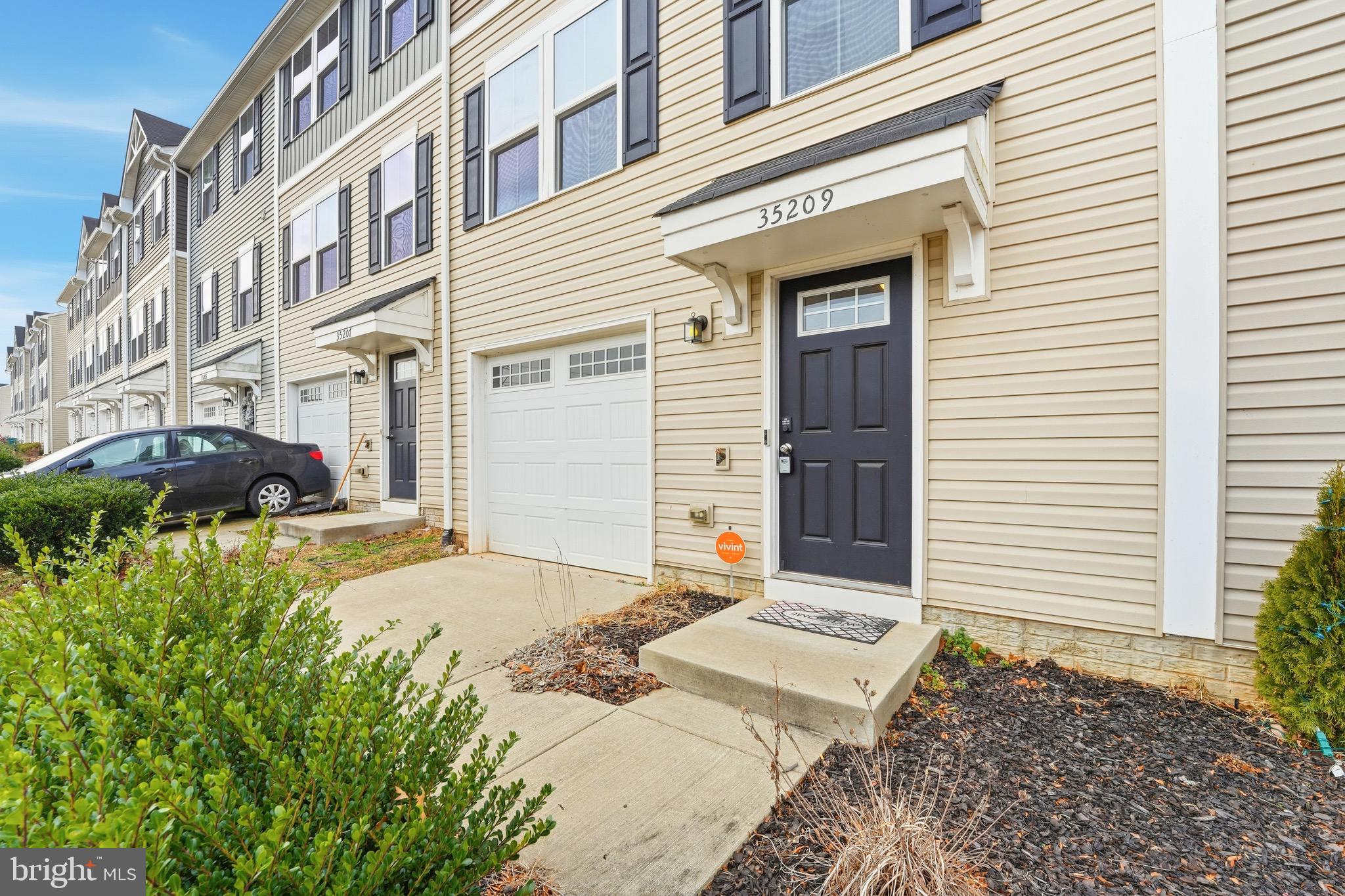 35209 Sara Court Locust Grove, VA 22508 - Photo 27 of 37 a front view of a house with a yard