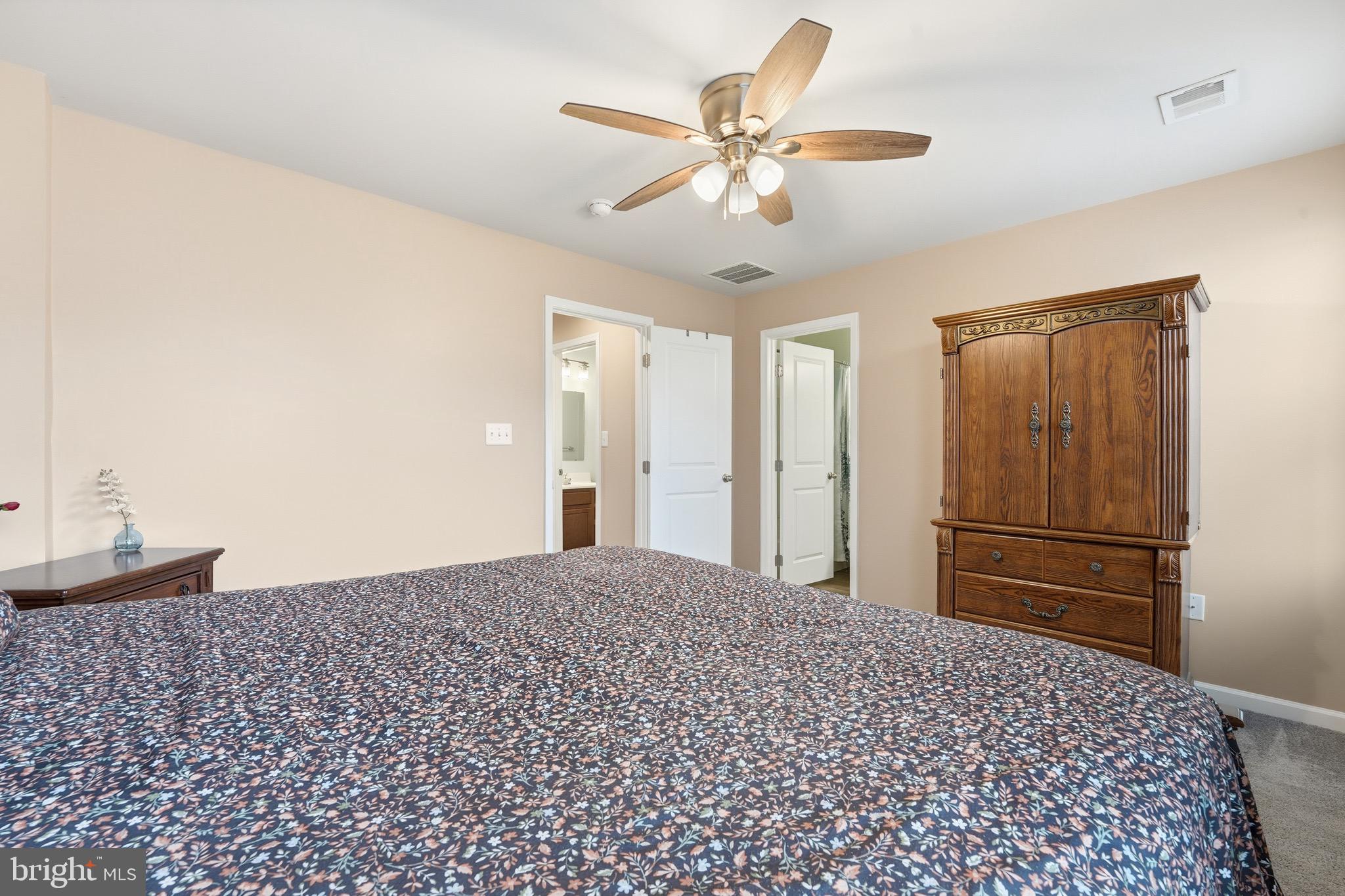 35209 Sara Court Locust Grove, VA 22508 - Photo 32 of 37 a view of a livingroom with a chandelier fan and windows