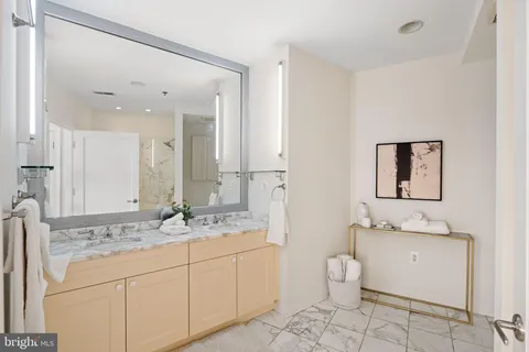 a bathroom with a double vanity sink and a mirror