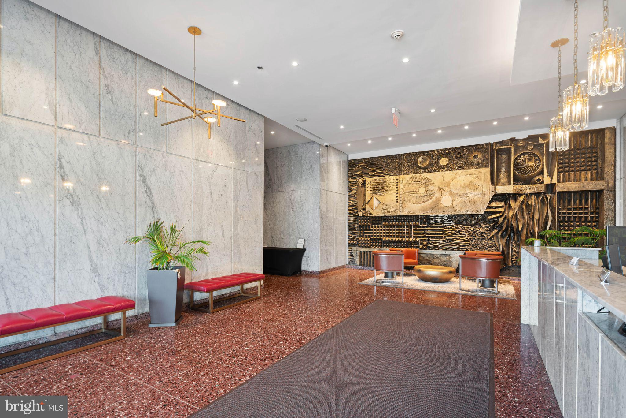 201-59 North 8th Street, Unit 603 Philadelphia, PA 19106 - Photo 32 of 35 a living room with furniture and flat screen tv