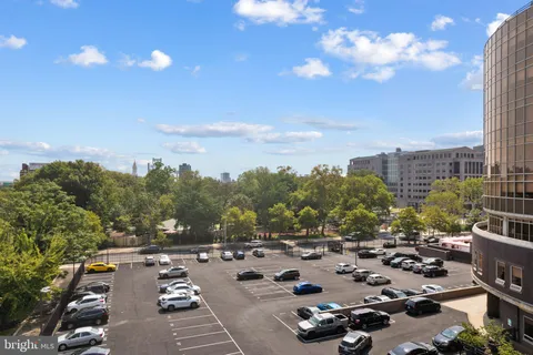 a view of a tall building from a balcony