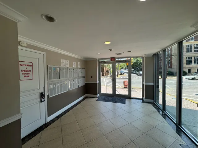 a view of an empty room with glass door