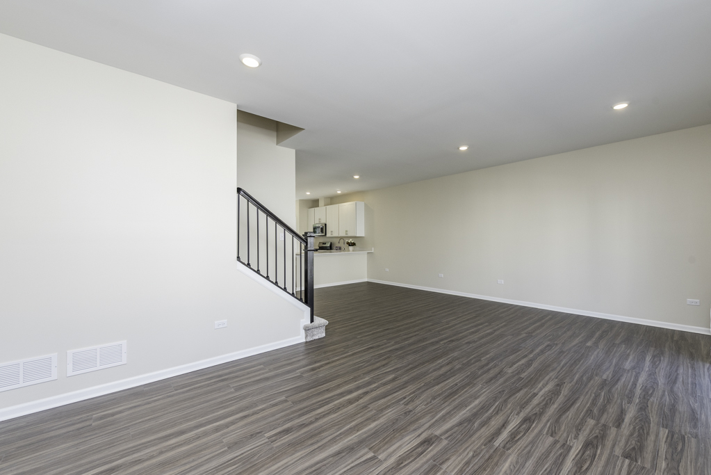 804 Neubauer Circle Lindenhurst, IL 60046 - Photo 4 of 30 a view of an empty room with wooden floor