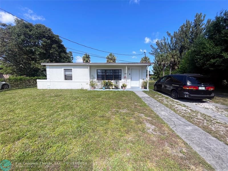 Broward Estates Lauderhill, FL 33311 - Photo 1 of 7 a view of a house with a yard