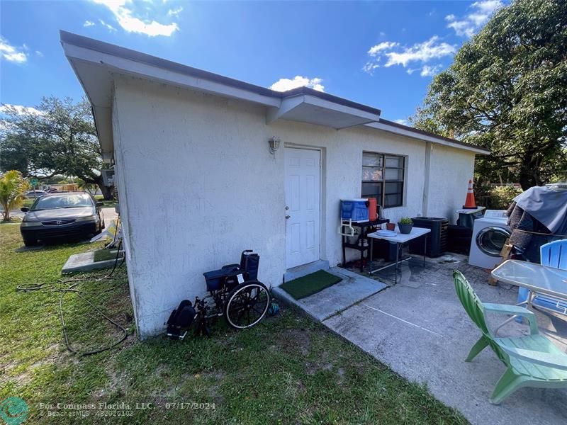 Broward Estates Lauderhill, FL 33311 - Photo 4 of 7 a view of a backyard with furniture and a grill