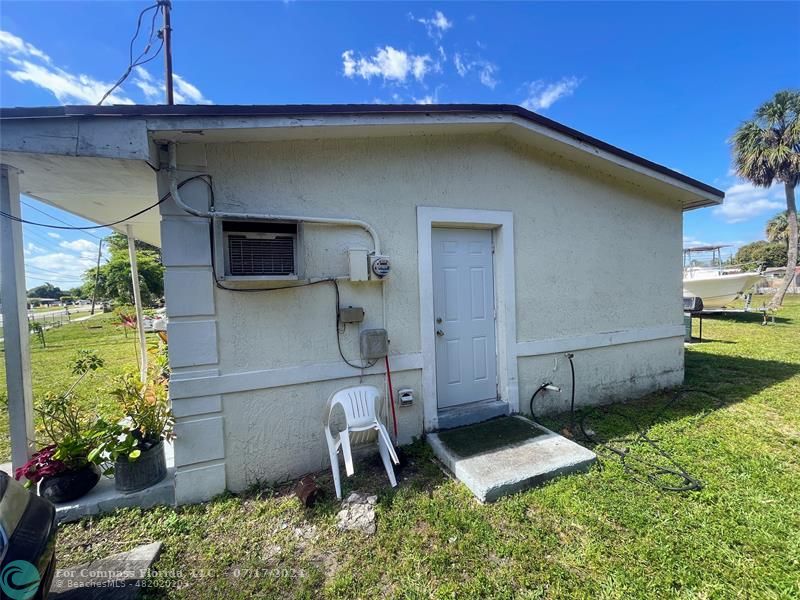 Broward Estates Lauderhill, FL 33311 - Photo 6 of 7 a front view of a house with a yard
