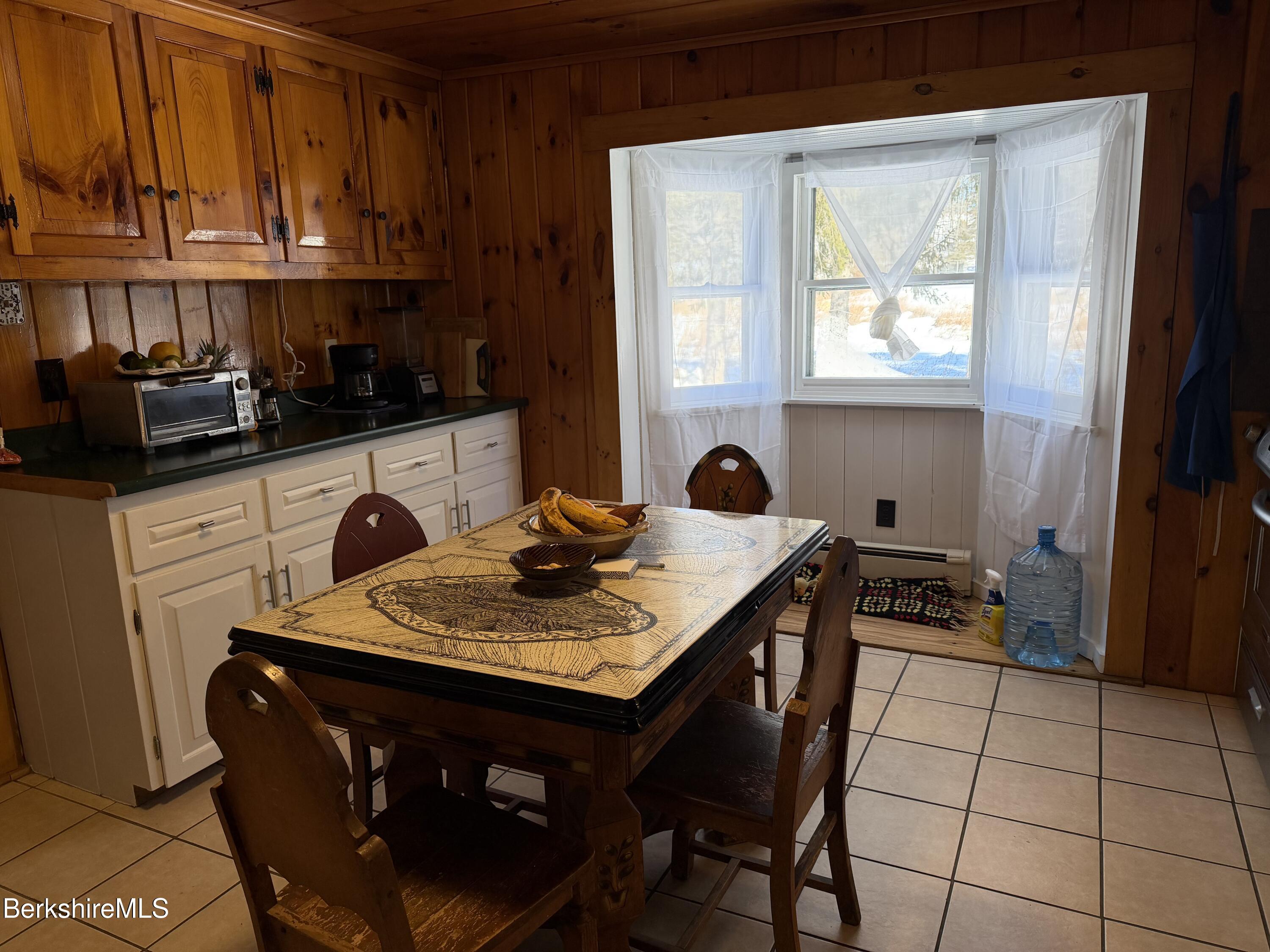 95 Water Farm Road Sheffield, MA 01257 - Photo 10 of 27 a kitchen with stainless steel appliances granite countertop a sink a stove a refrigerator and cabinets