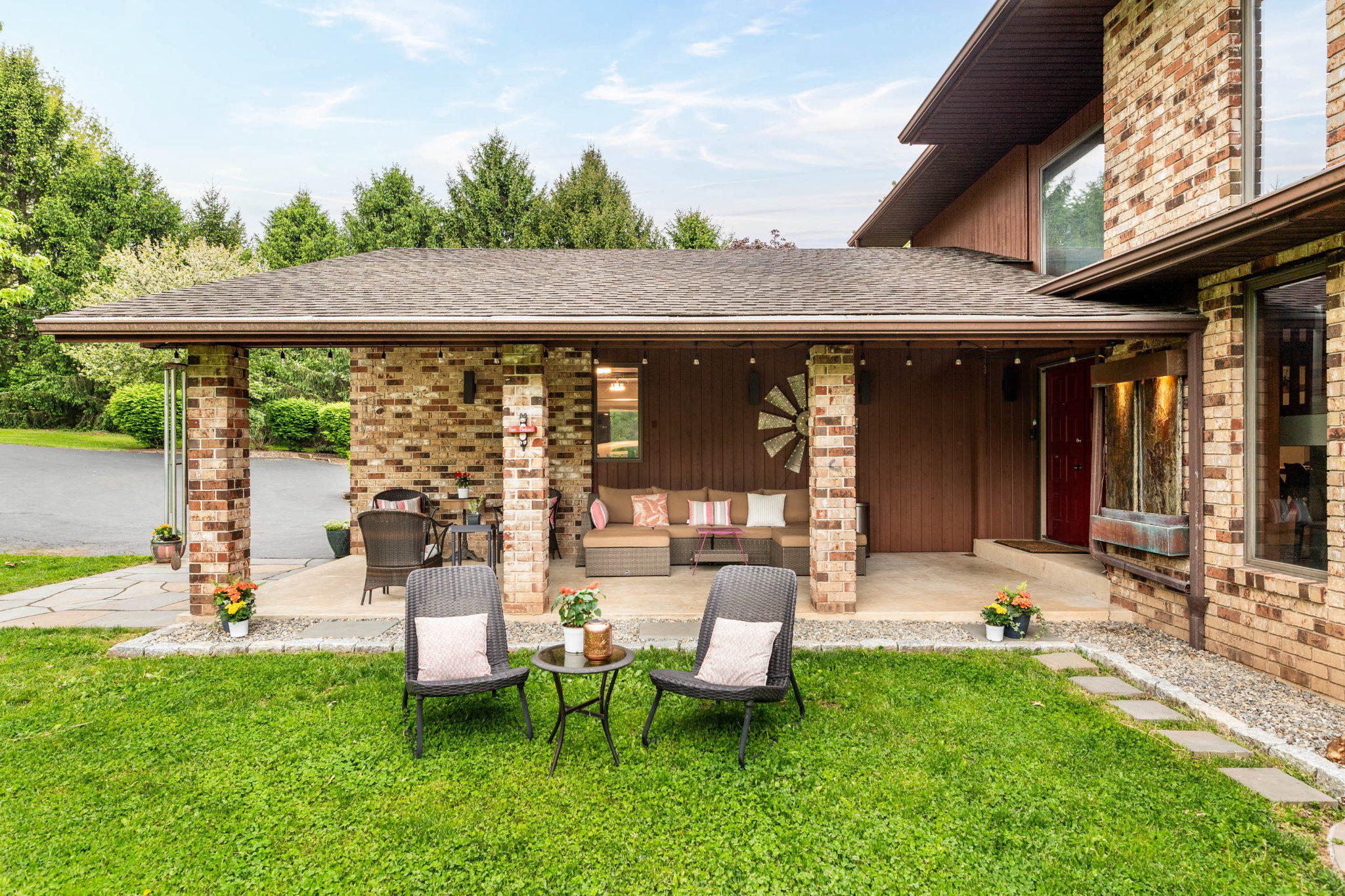 703 Ridge Road Pottstown, PA 19465 - Photo 4 of 68 Spacious covered patio to enjoy in rain or shine