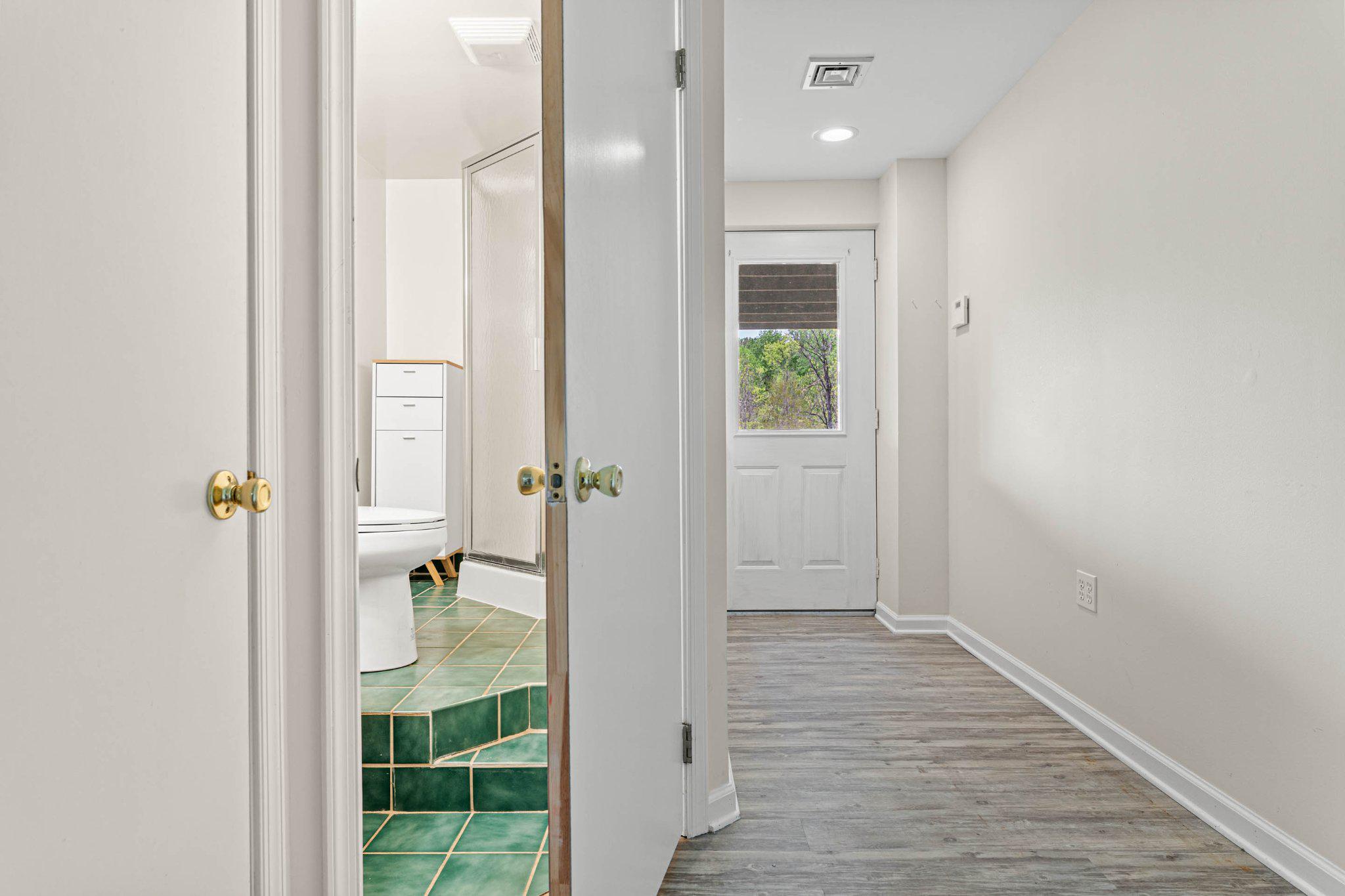 703 Ridge Road Pottstown, PA 19465 - Photo 47 of 68 Lower level hallway with exterior access