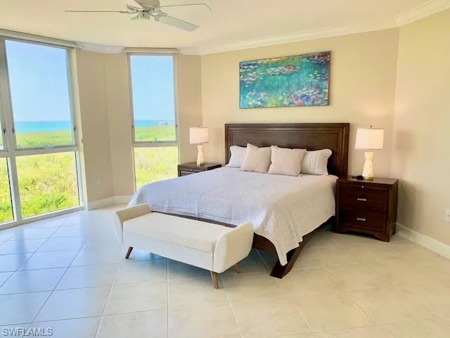 a spacious bedroom with a bed and a window