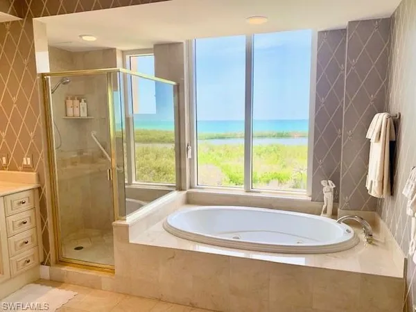 a bath tub sitting next to a window