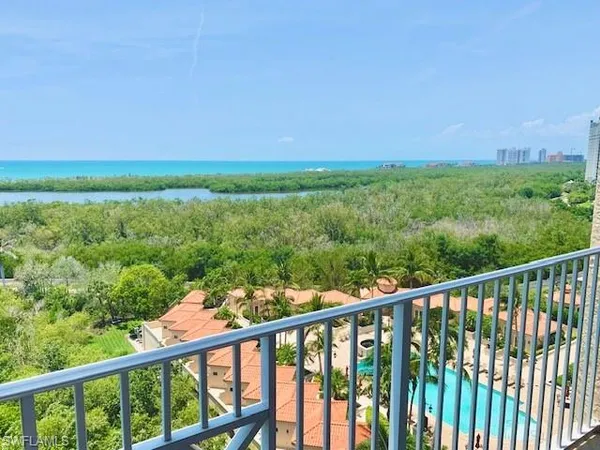 a view of a forest from a balcony