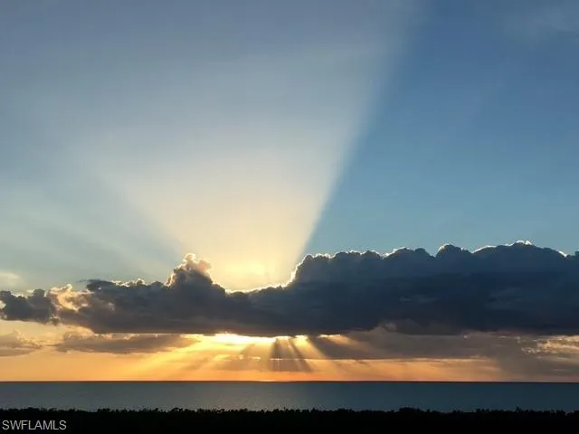 a view of sunset and a city