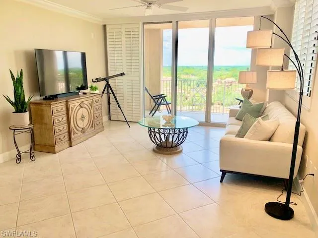 a living room with couches and a flat screen tv