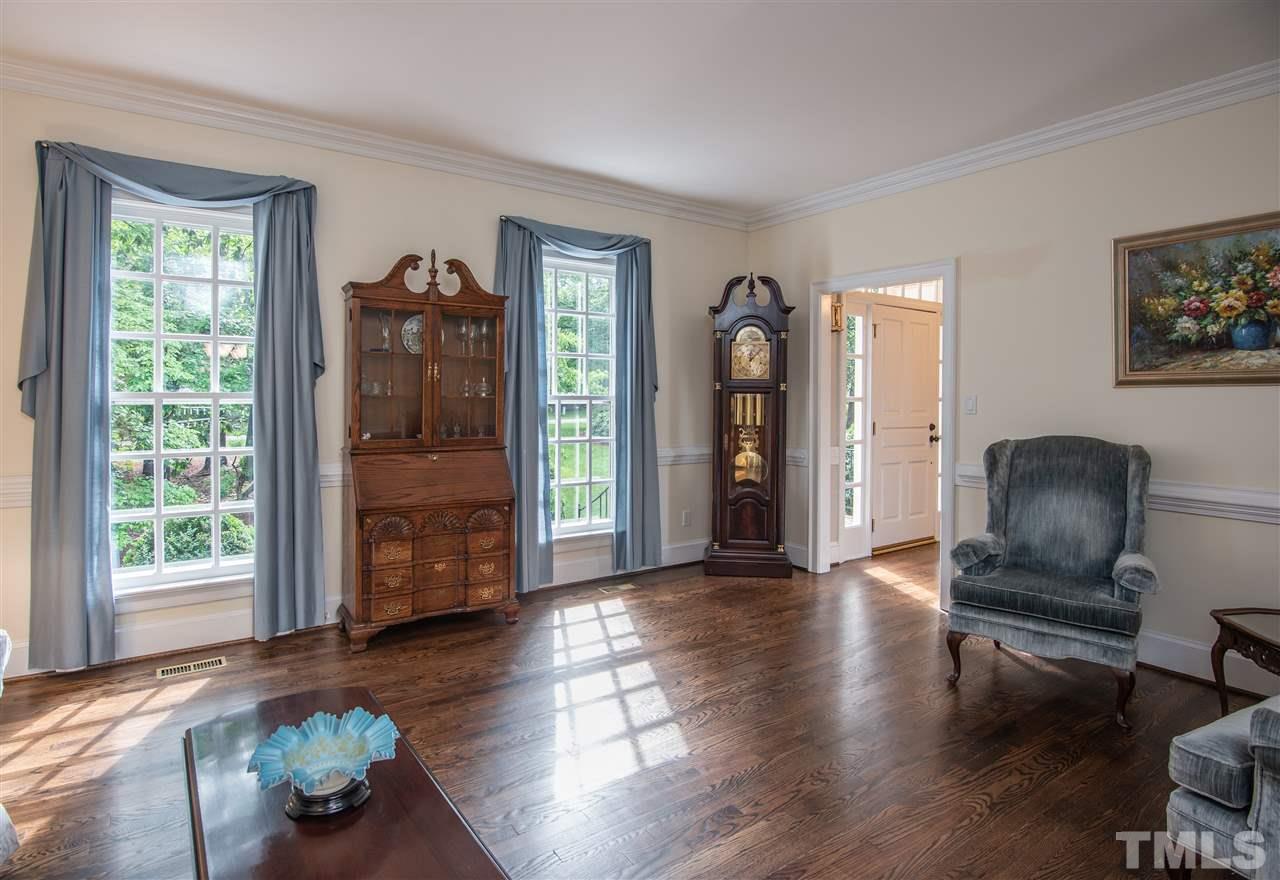 809 Ascot Lane Raleigh, NC 27615 - Photo 3 of 25 a living room with furniture and a window
