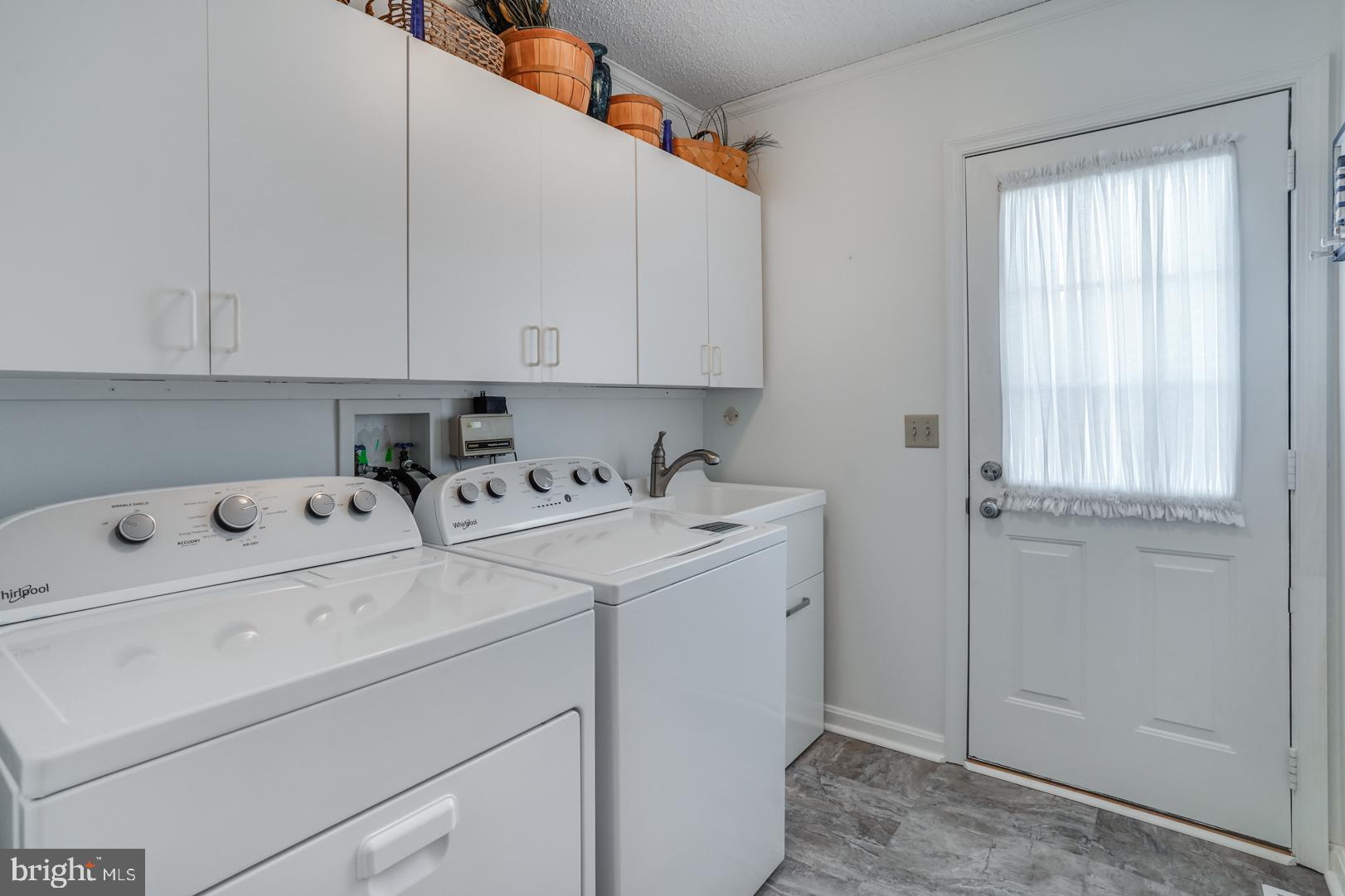 13702 Sailing Road Ocean City, MD 21842 - Photo 14 of 32 a view of storage and utility room with washer and dryer
