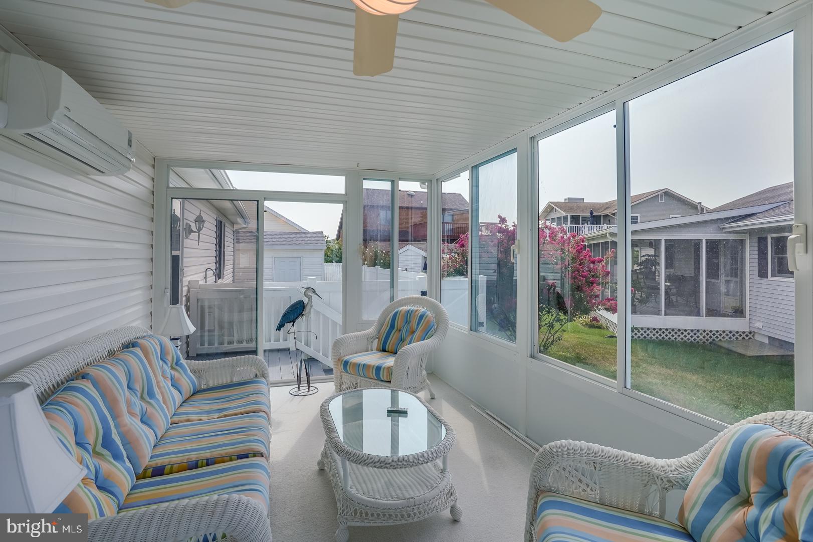 13702 Sailing Road Ocean City, MD 21842 - Photo 16 of 32 a view of a patio with couches chairs and potted plants