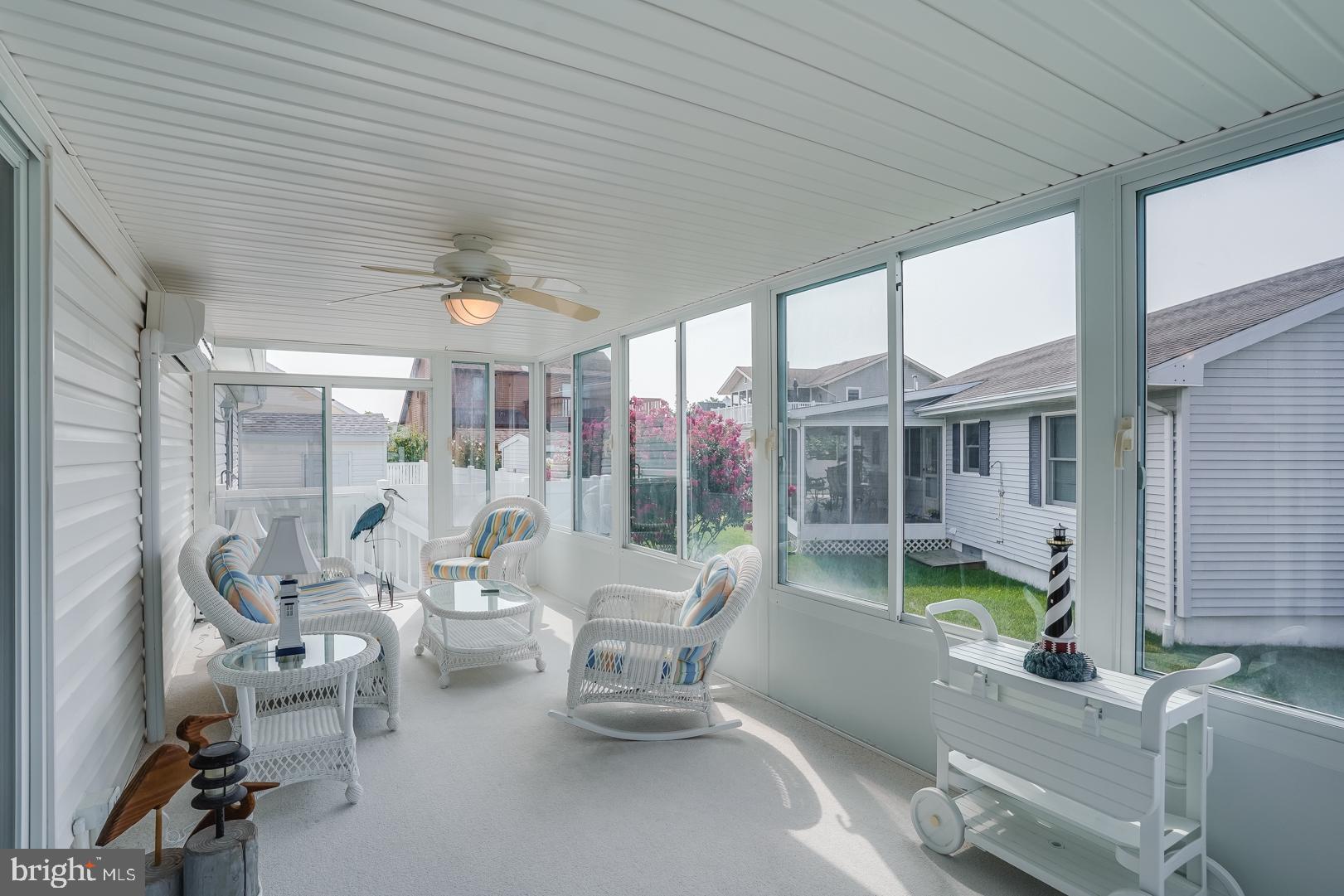 13702 Sailing Road Ocean City, MD 21842 - Photo 17 of 32 a living room with furniture and a large window