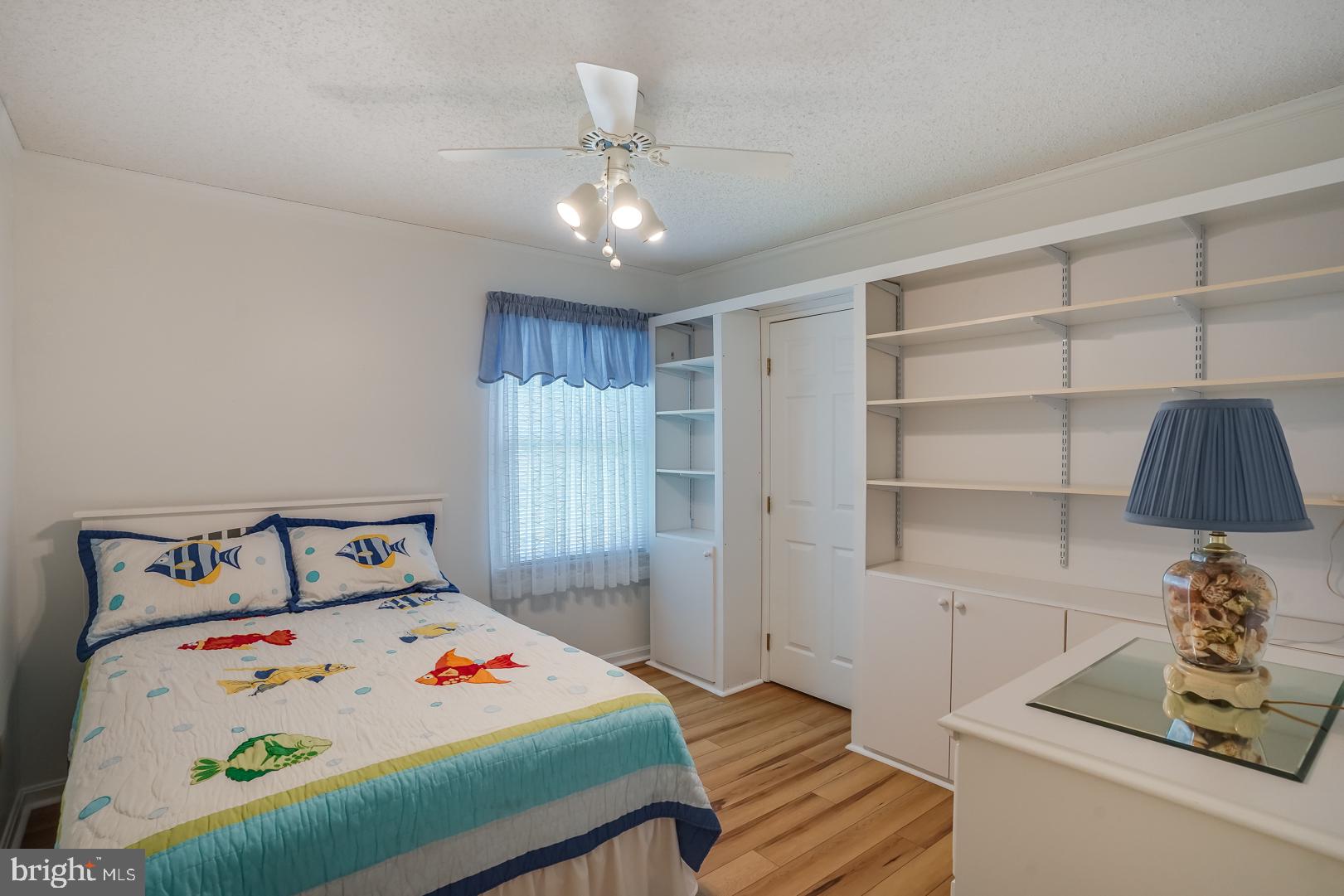 13702 Sailing Road Ocean City, MD 21842 - Photo 22 of 32 a bedroom with a bed and a window