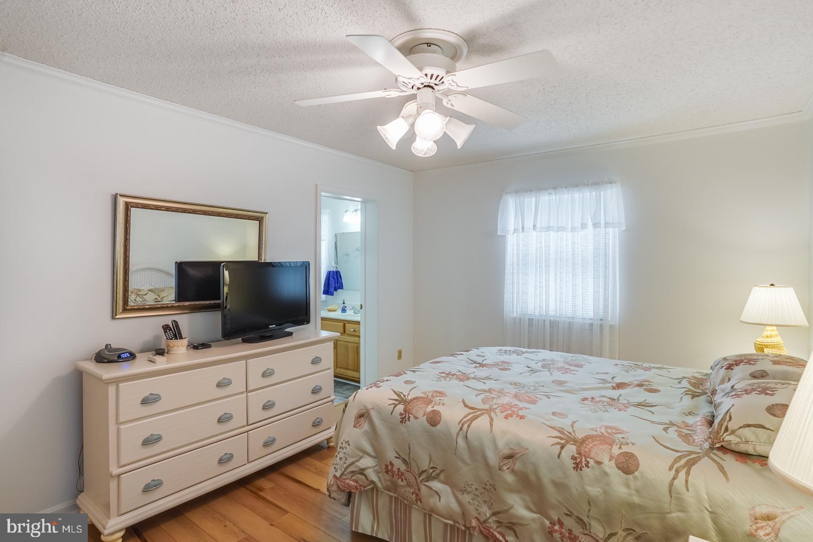 13702 Sailing Road Ocean City, MD 21842 - Photo 24 of 32 a bedroom with a bed and a flat screen tv