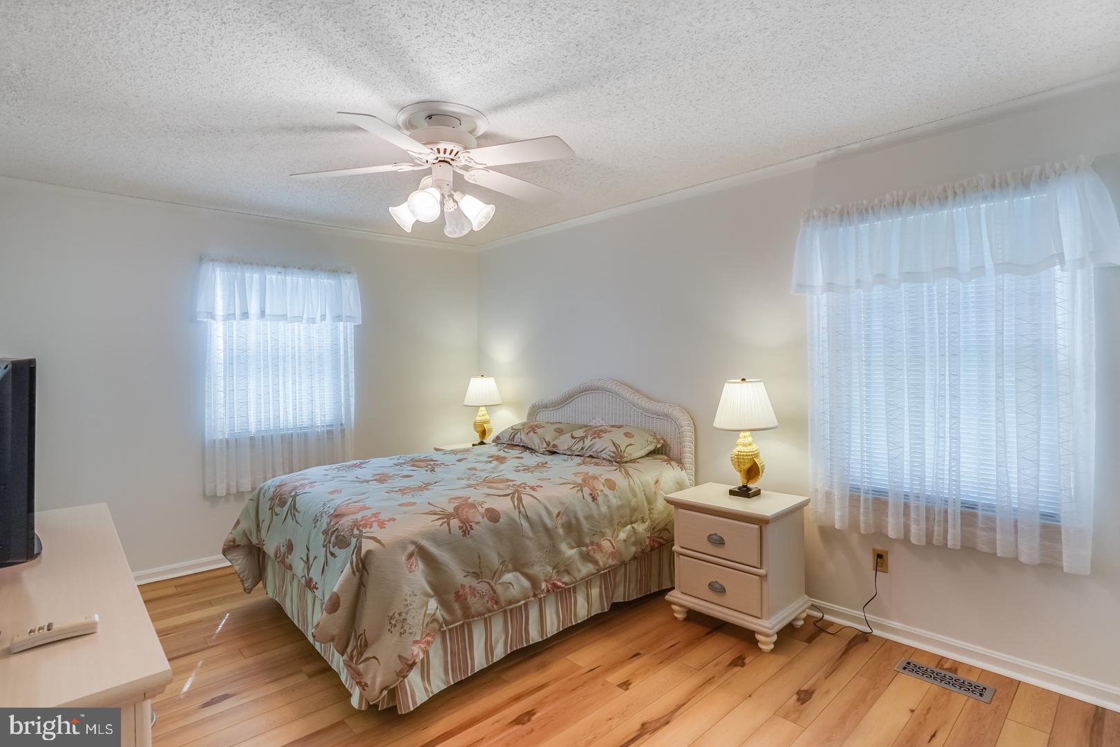 13702 Sailing Road Ocean City, MD 21842 - Photo 25 of 32 a bedroom with a bed and window