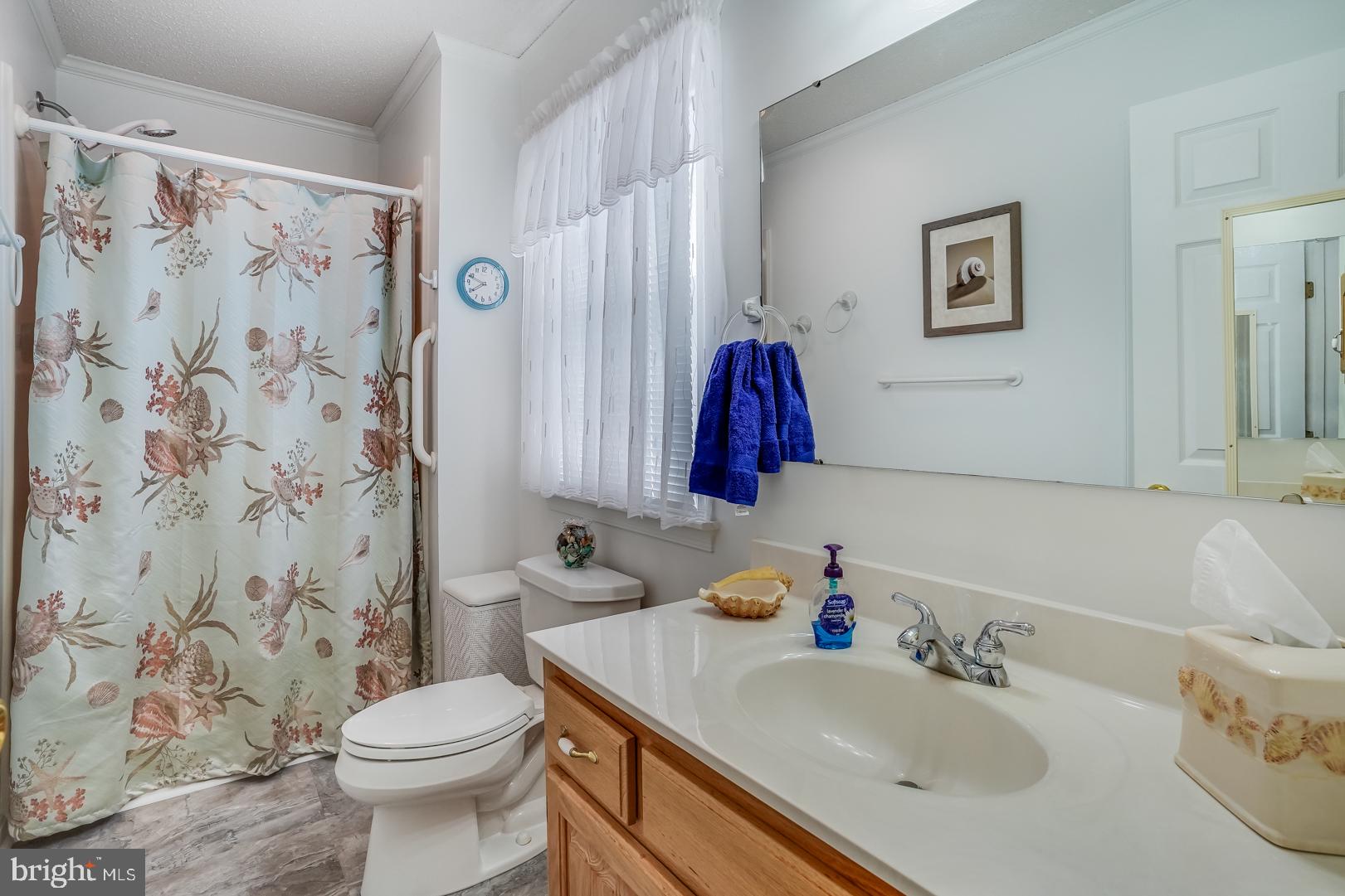 13702 Sailing Road Ocean City, MD 21842 - Photo 26 of 32 a bathroom with a sink toilet and shower
