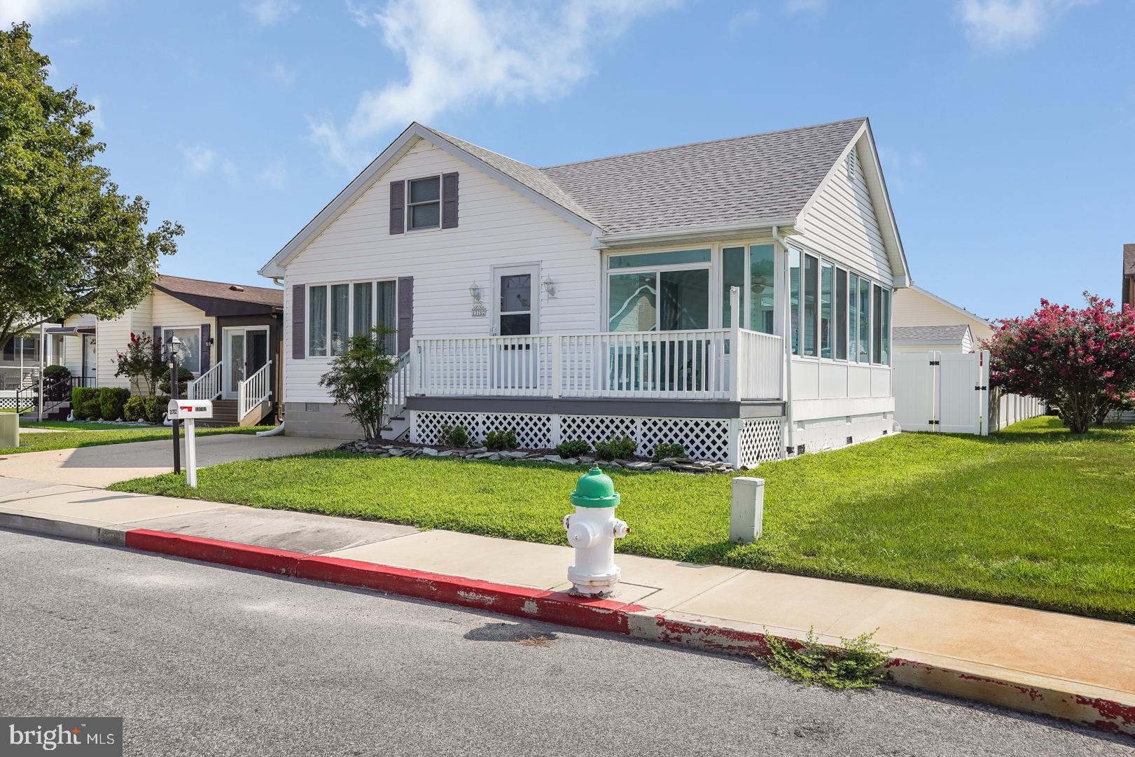 13702 Sailing Road Ocean City, MD 21842 - Photo 30 of 32 a front view of house with yard and green space