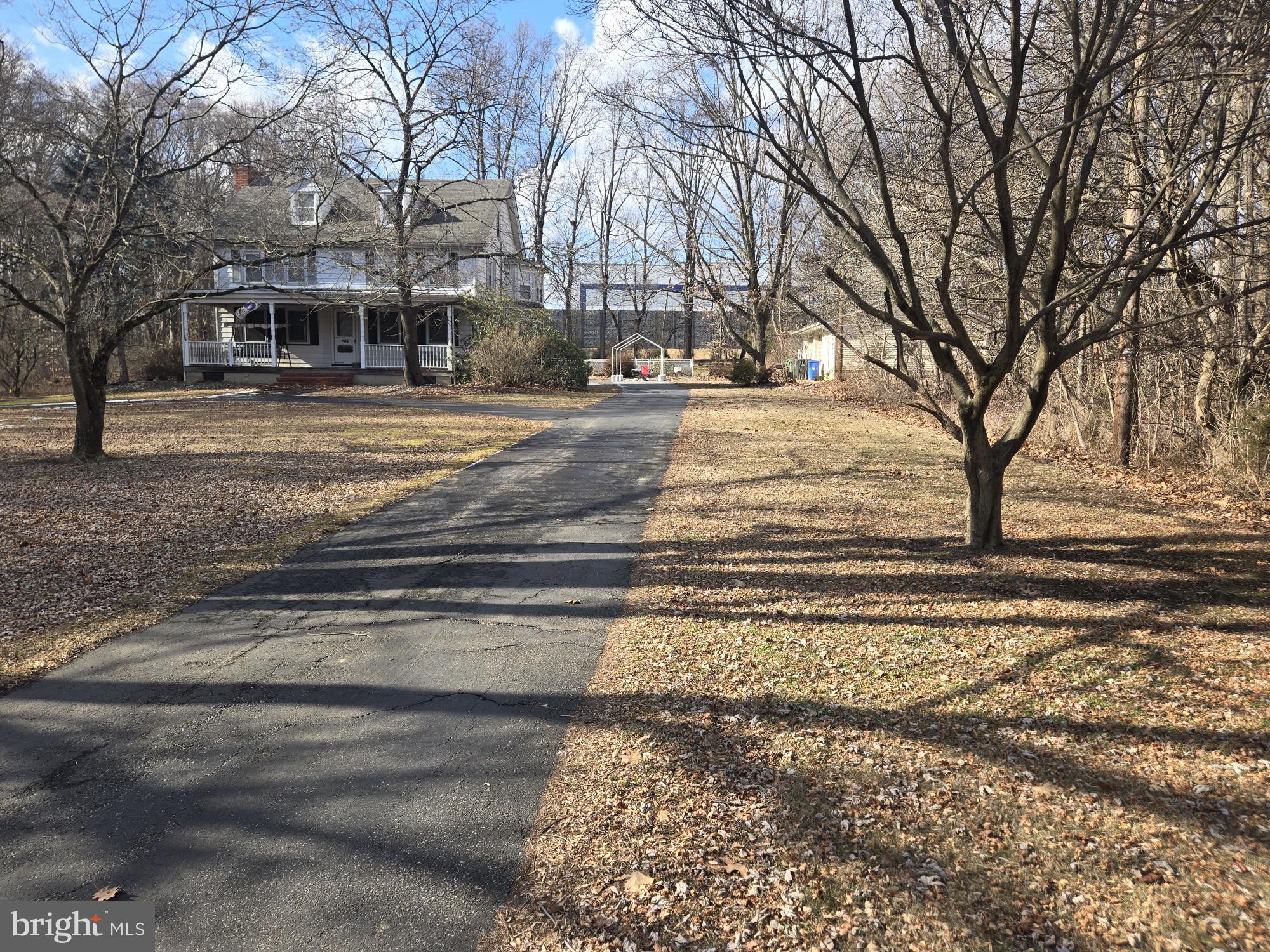 48 Garwin Road Swedesboro, NJ 08085 - Photo 5 of 7 a building with trees in front of it