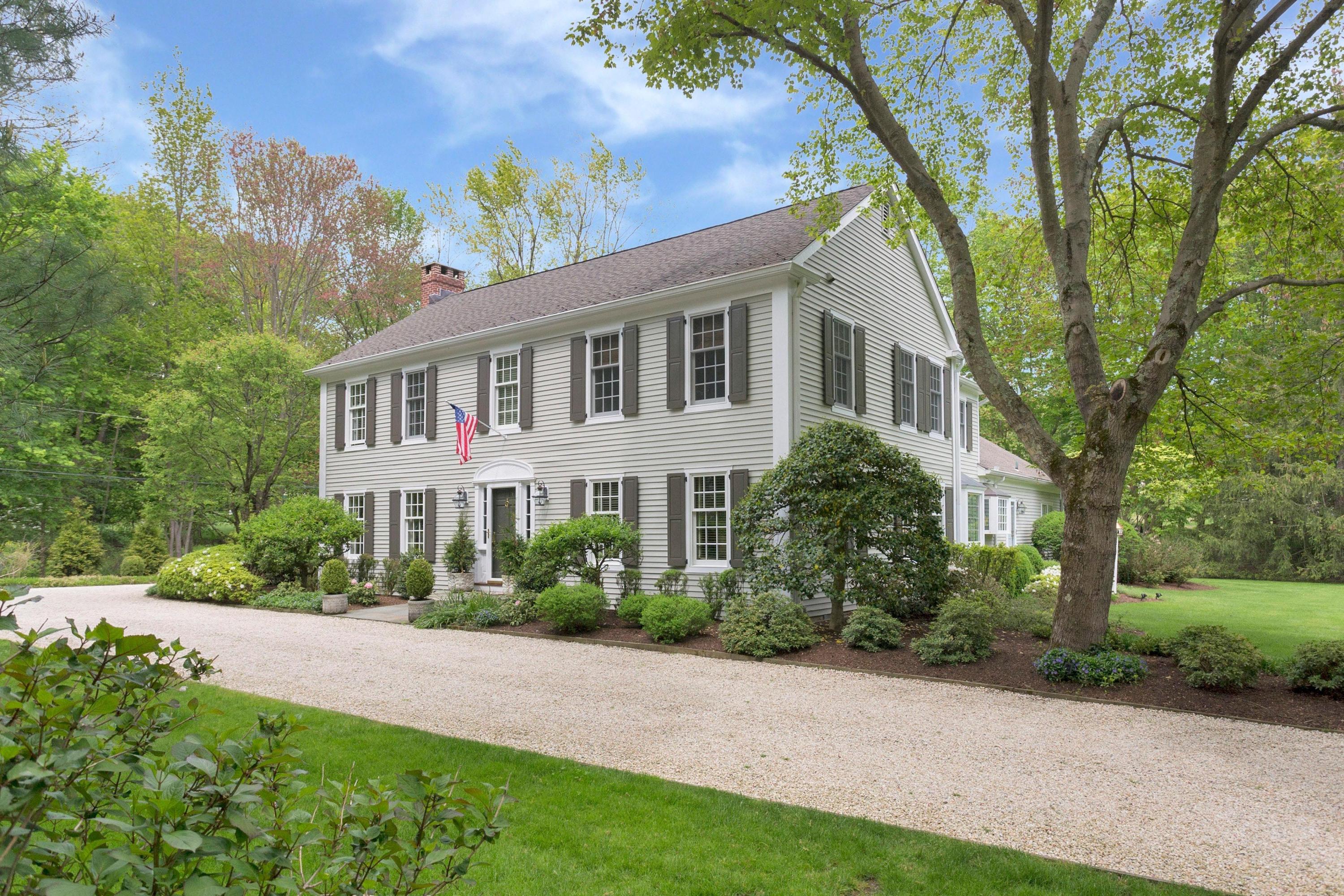 350 Middlesex Road Darien, CT 06820 - Photo 1 of 23 a front view of a house with a yard