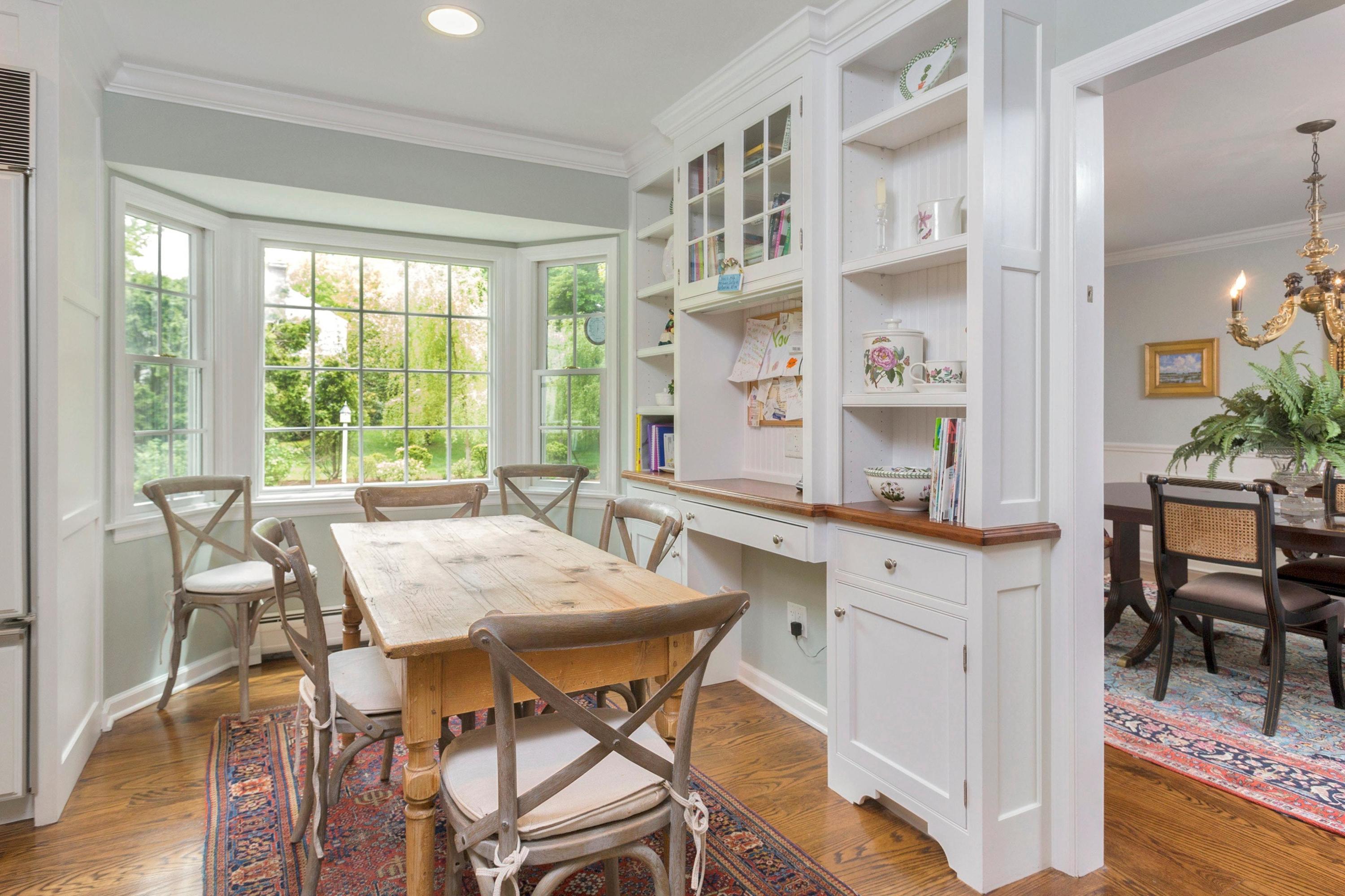350 Middlesex Road Darien, CT 06820 - Photo 11 of 23 a view of a dining room with furniture and a potted plant